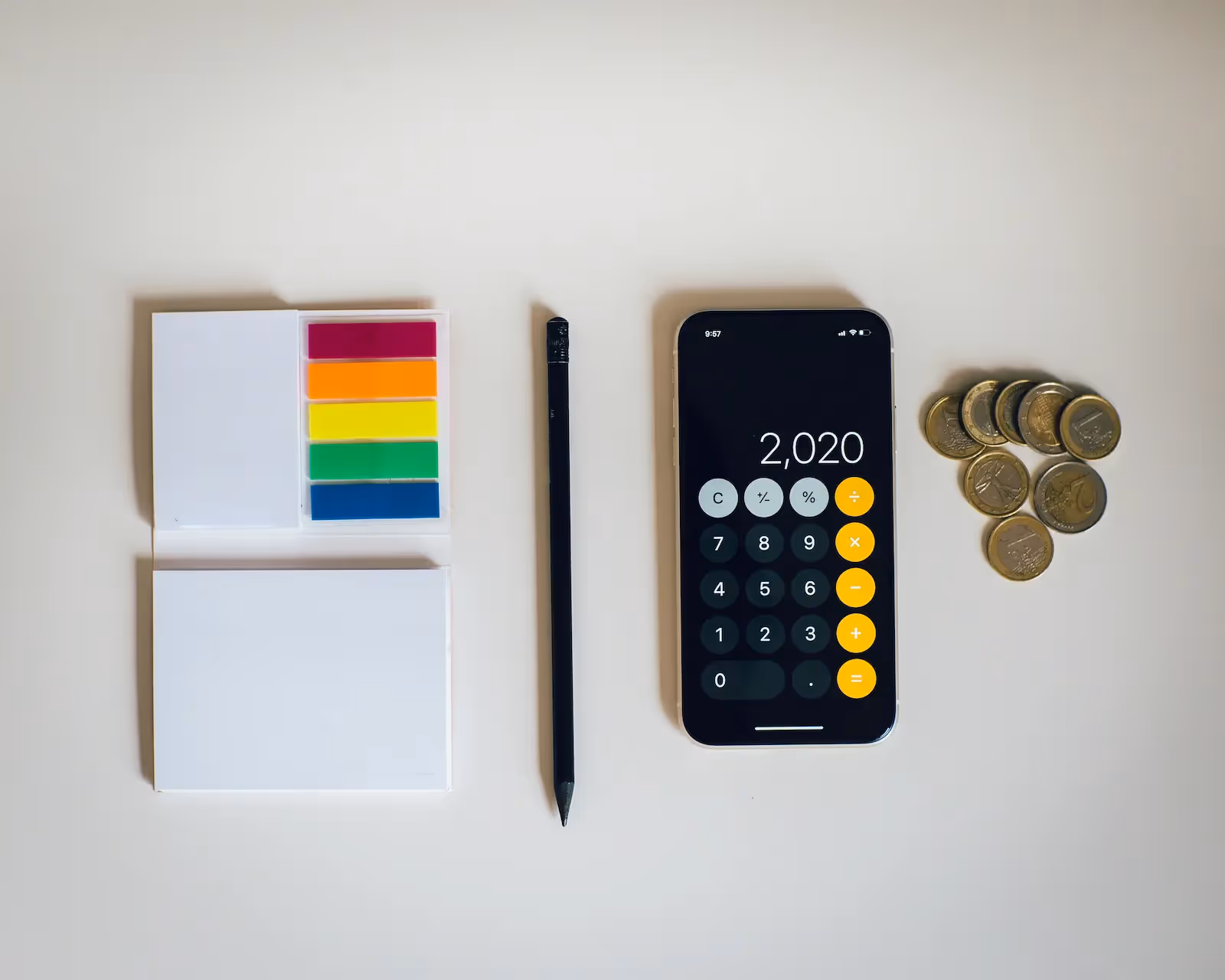 Person calculating their taxes with a calculator