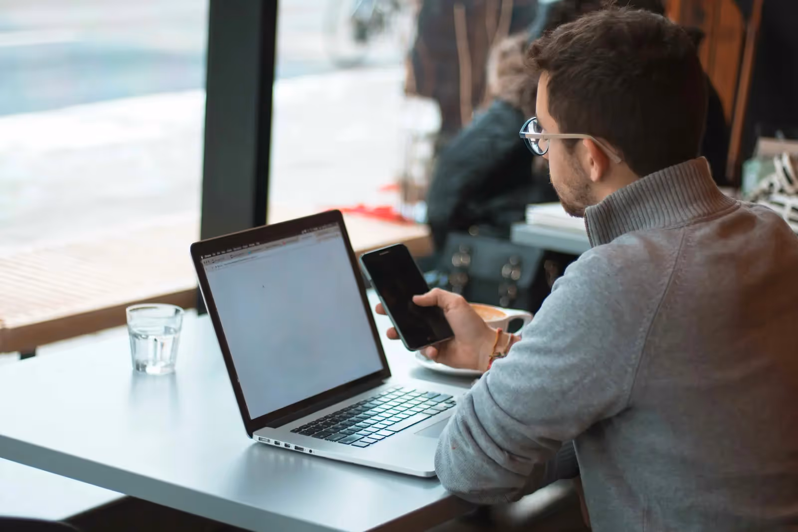 Man on Mercury Bank on laptop
