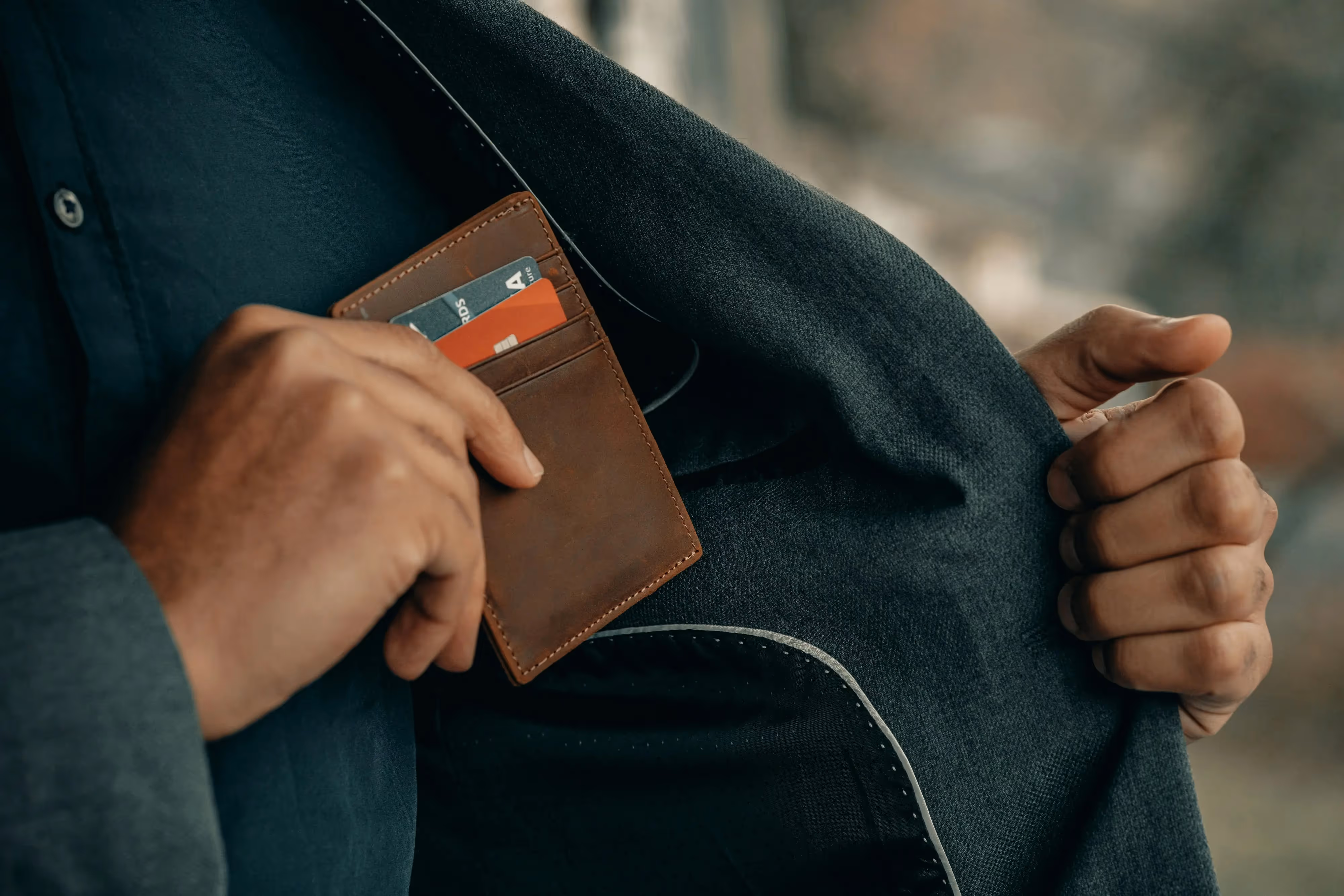 Person putting his wallet inside his pocket