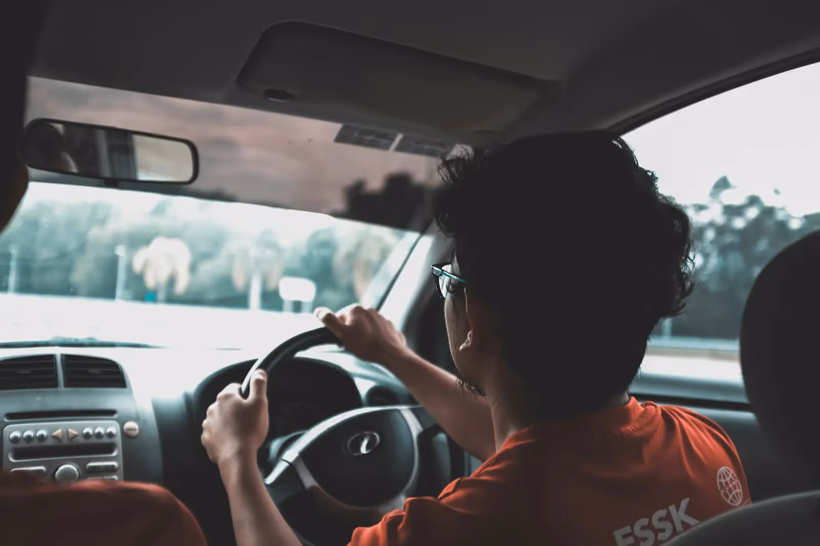 Picture of a person driving a car