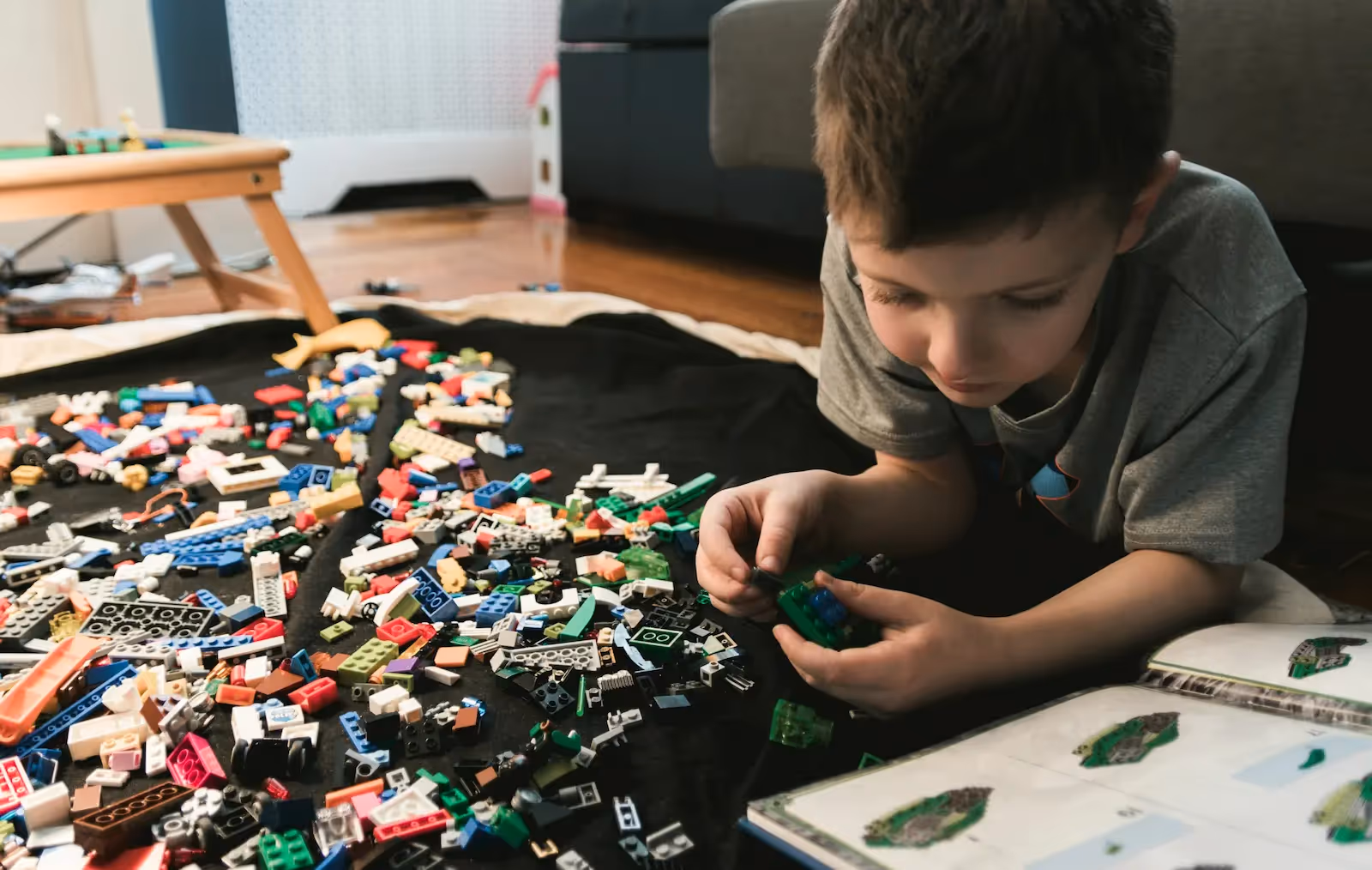 A child building Lego blocks