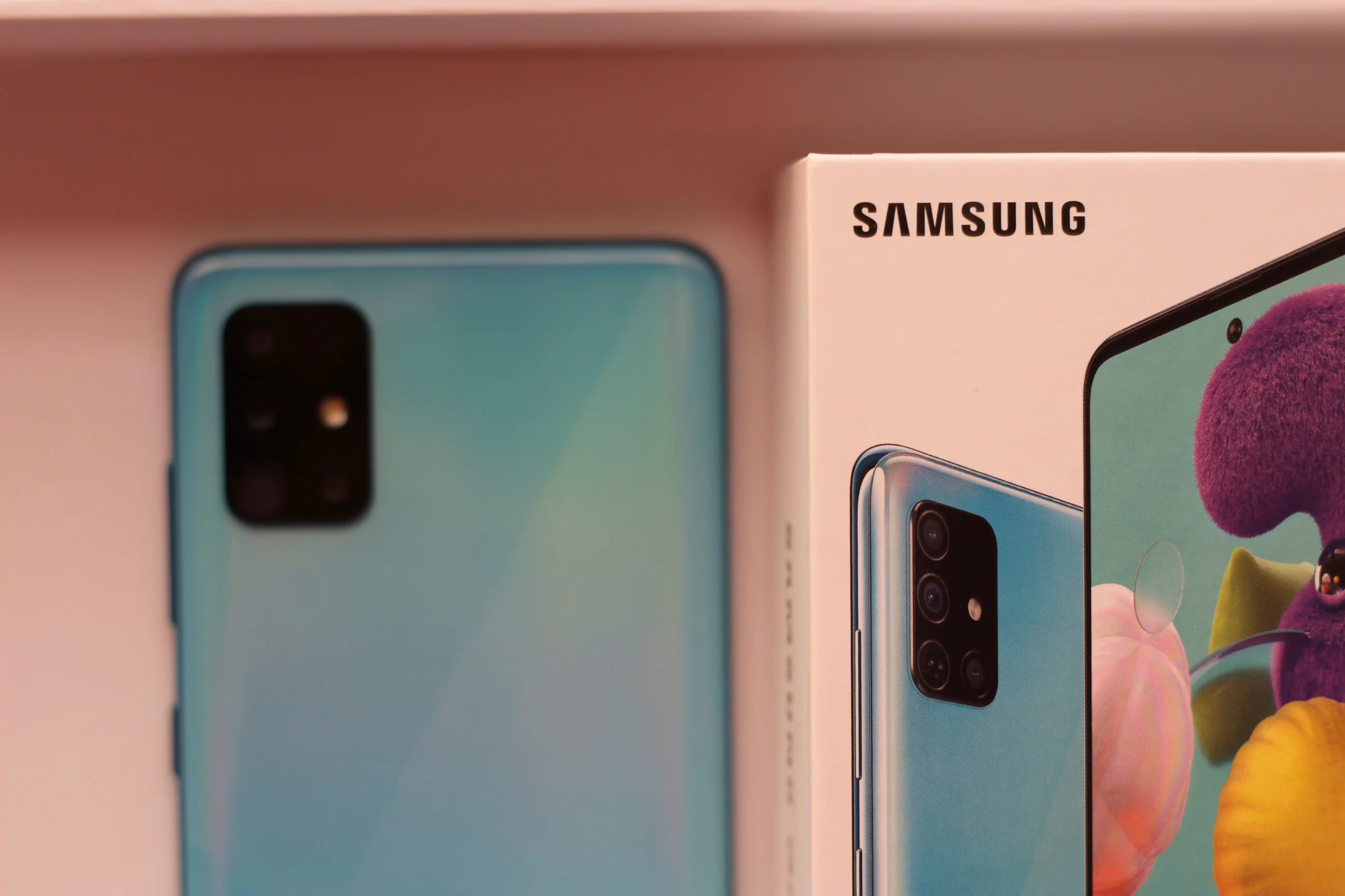 A Samsung phone beside it's box