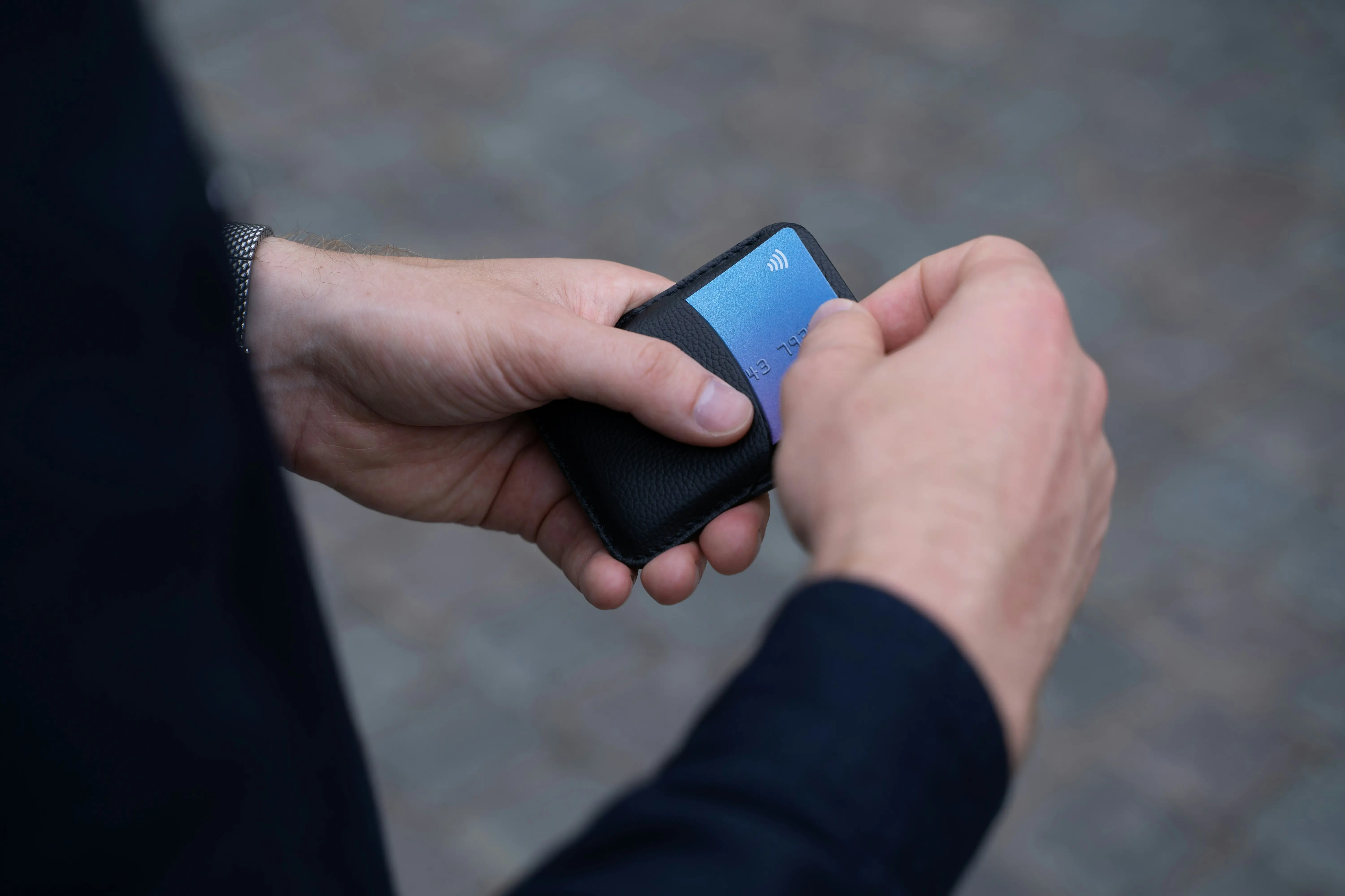 Person holding a credit card holder