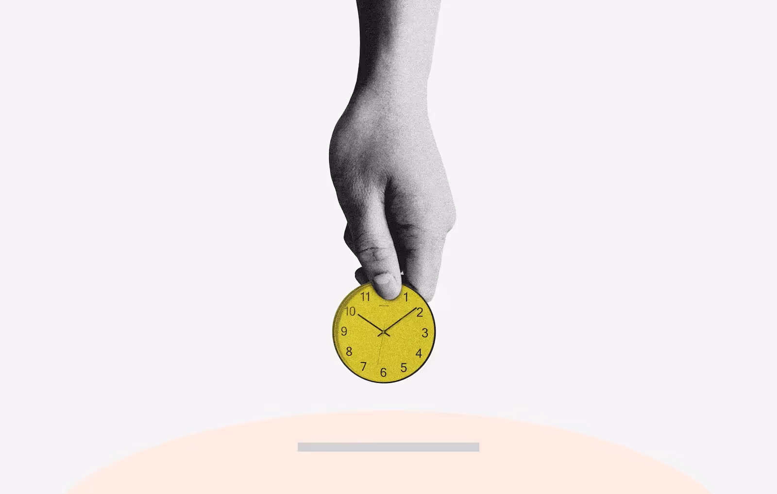 Hand holding a clock