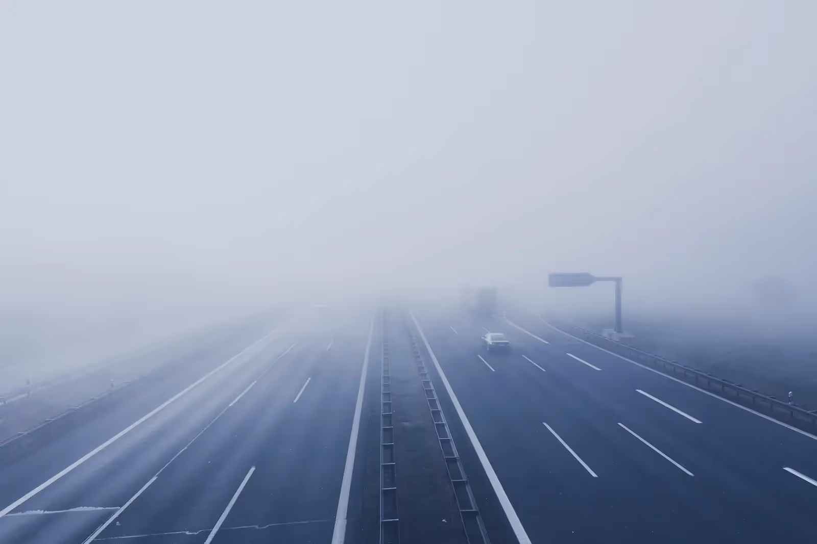 Car on a foggy road