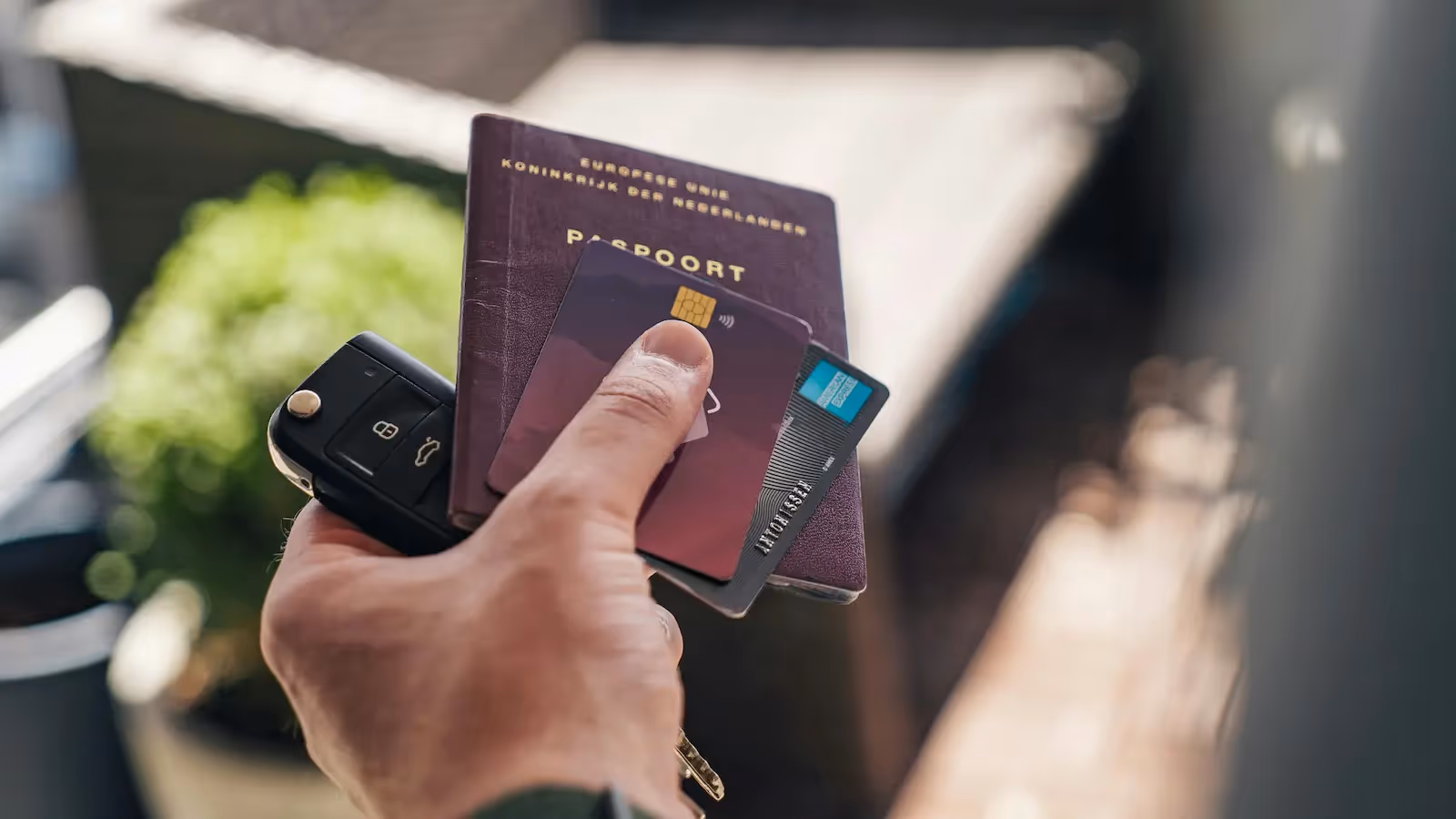 Person holding credit cards