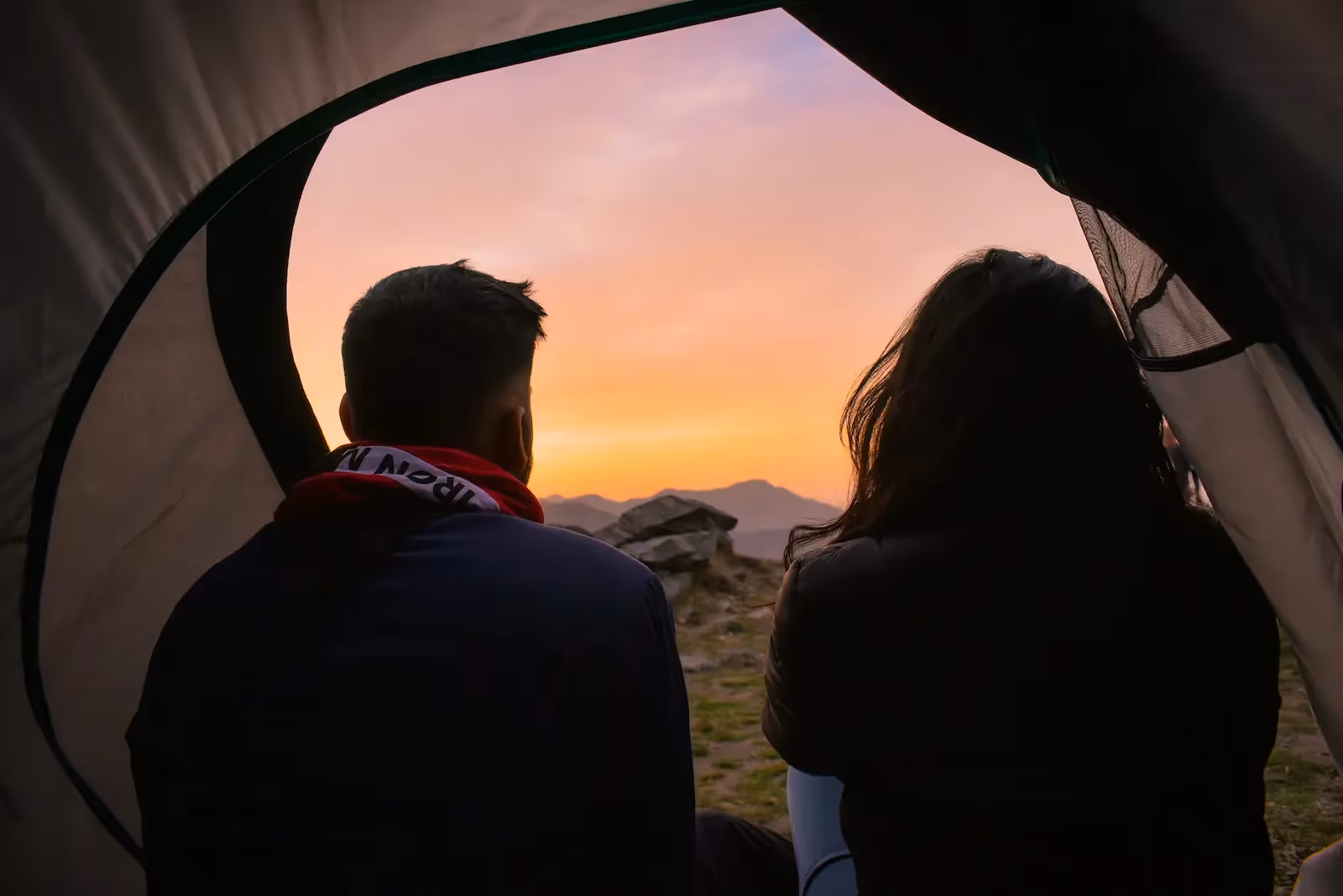Two people inside a tent
