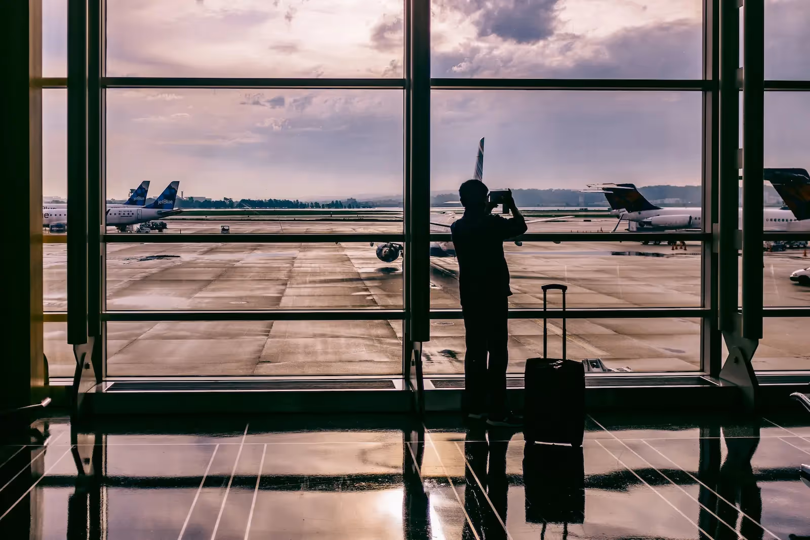 Person standing beside a luggage