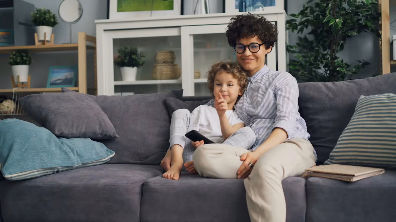 An adult and a toddler on a couch