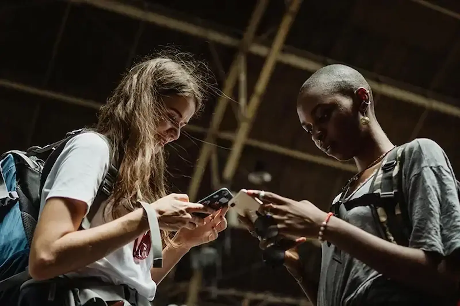 Two people using their phones