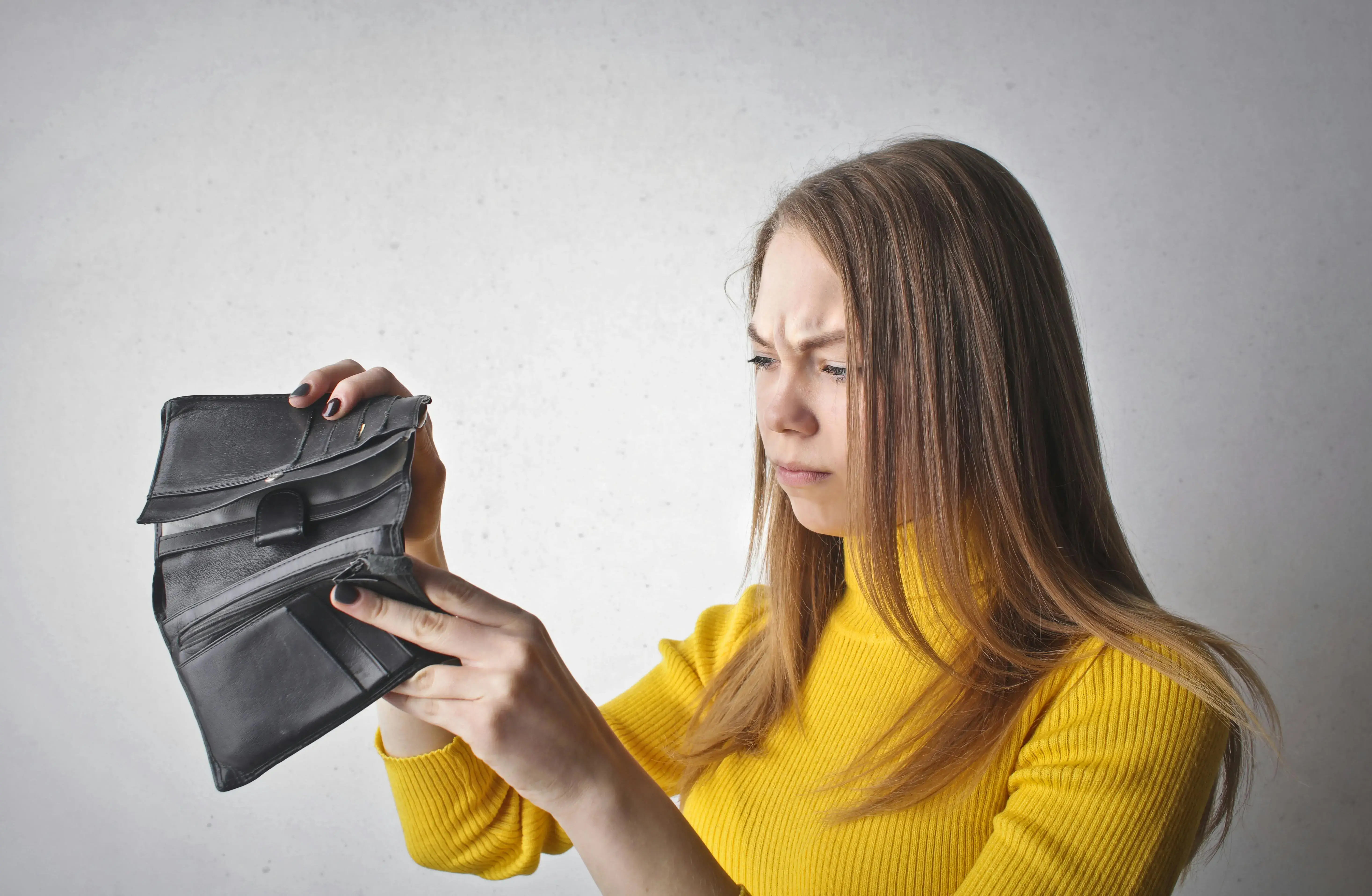 Person holding a wallet
