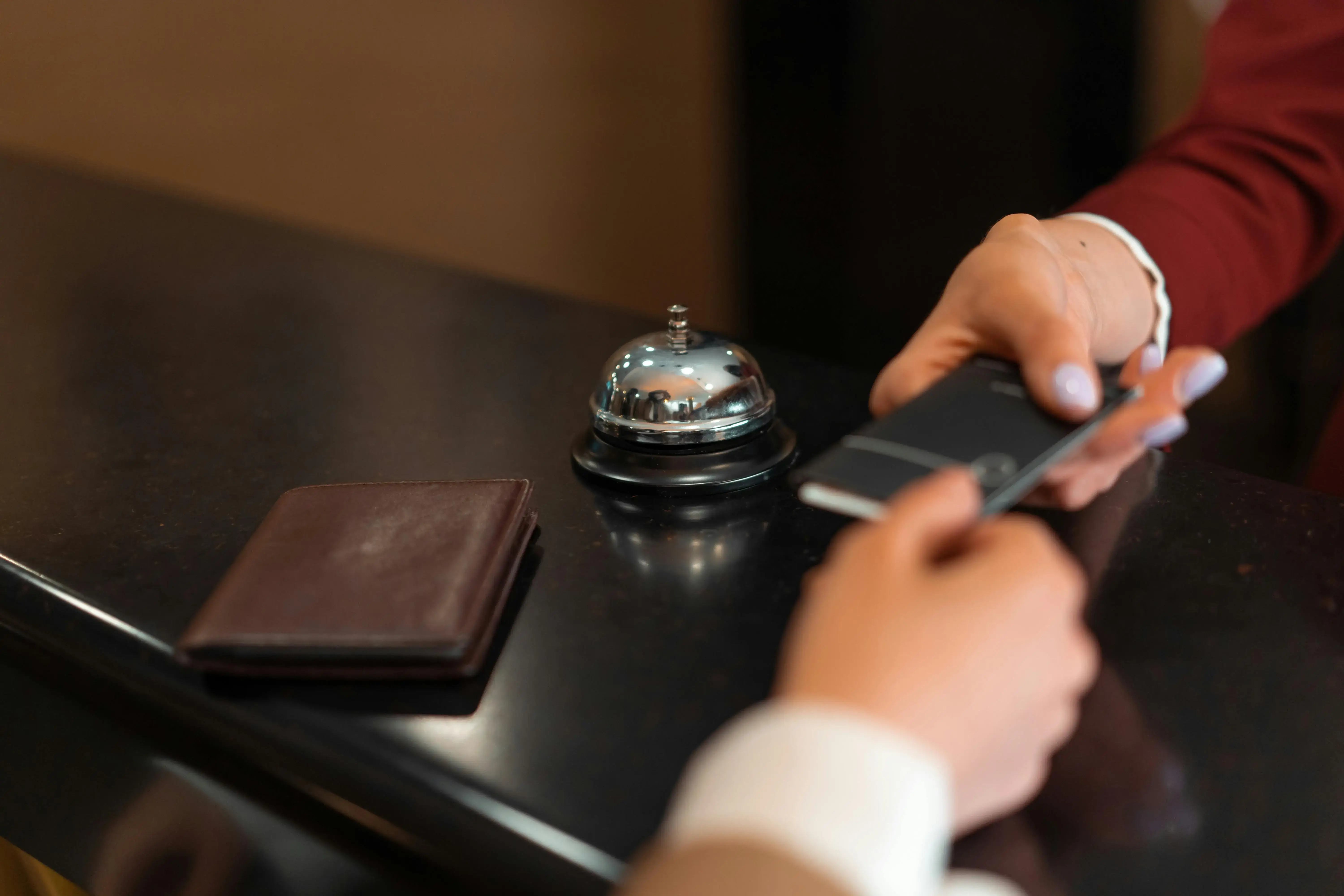 Two people holding a guest card