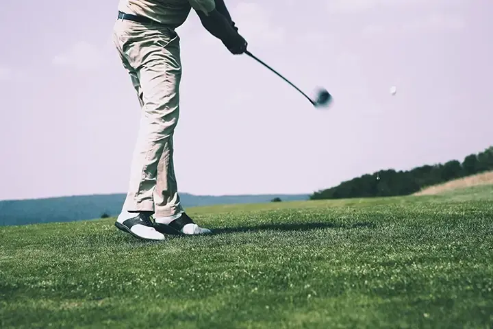 Person playing golf