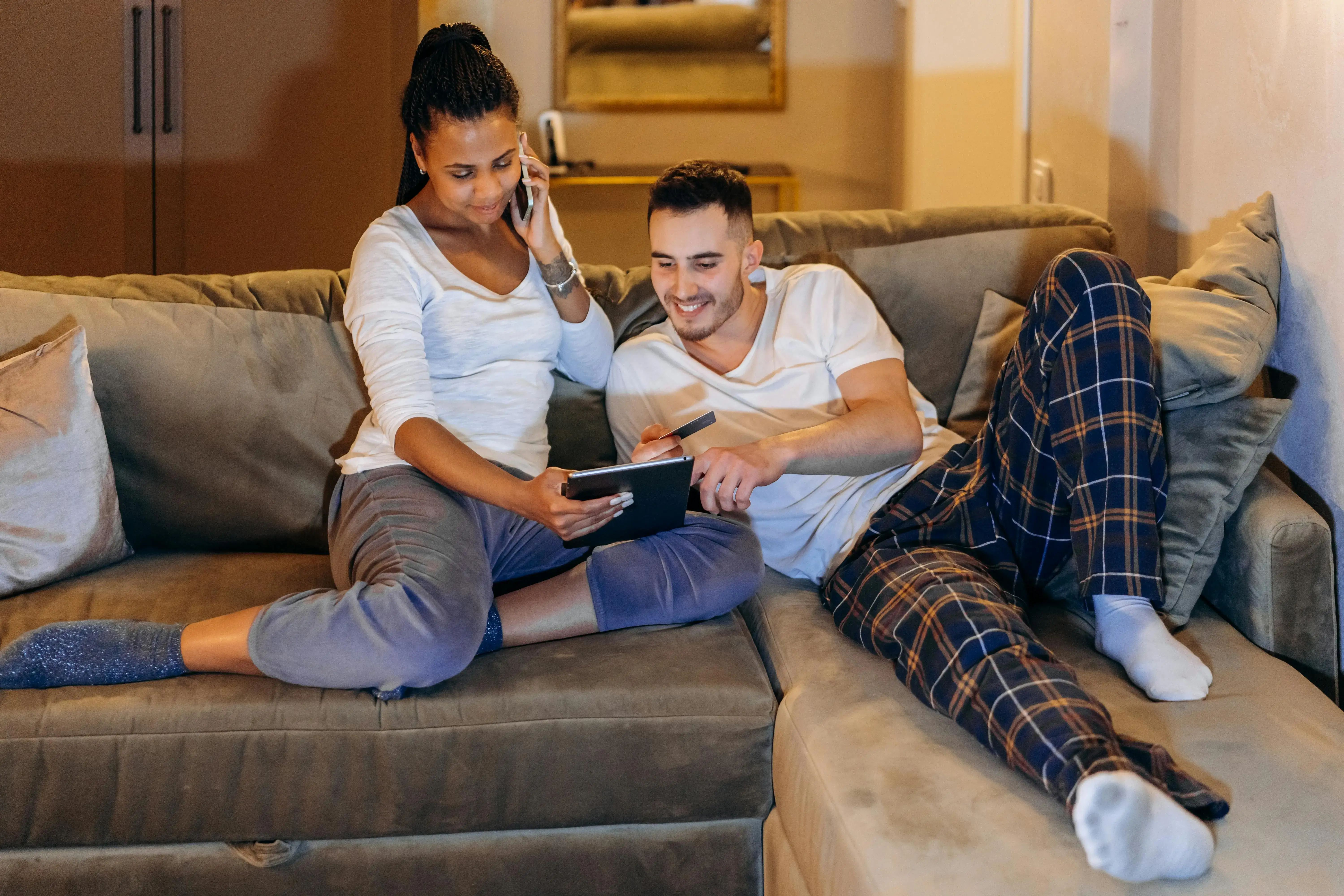 Two people looking at a notebook