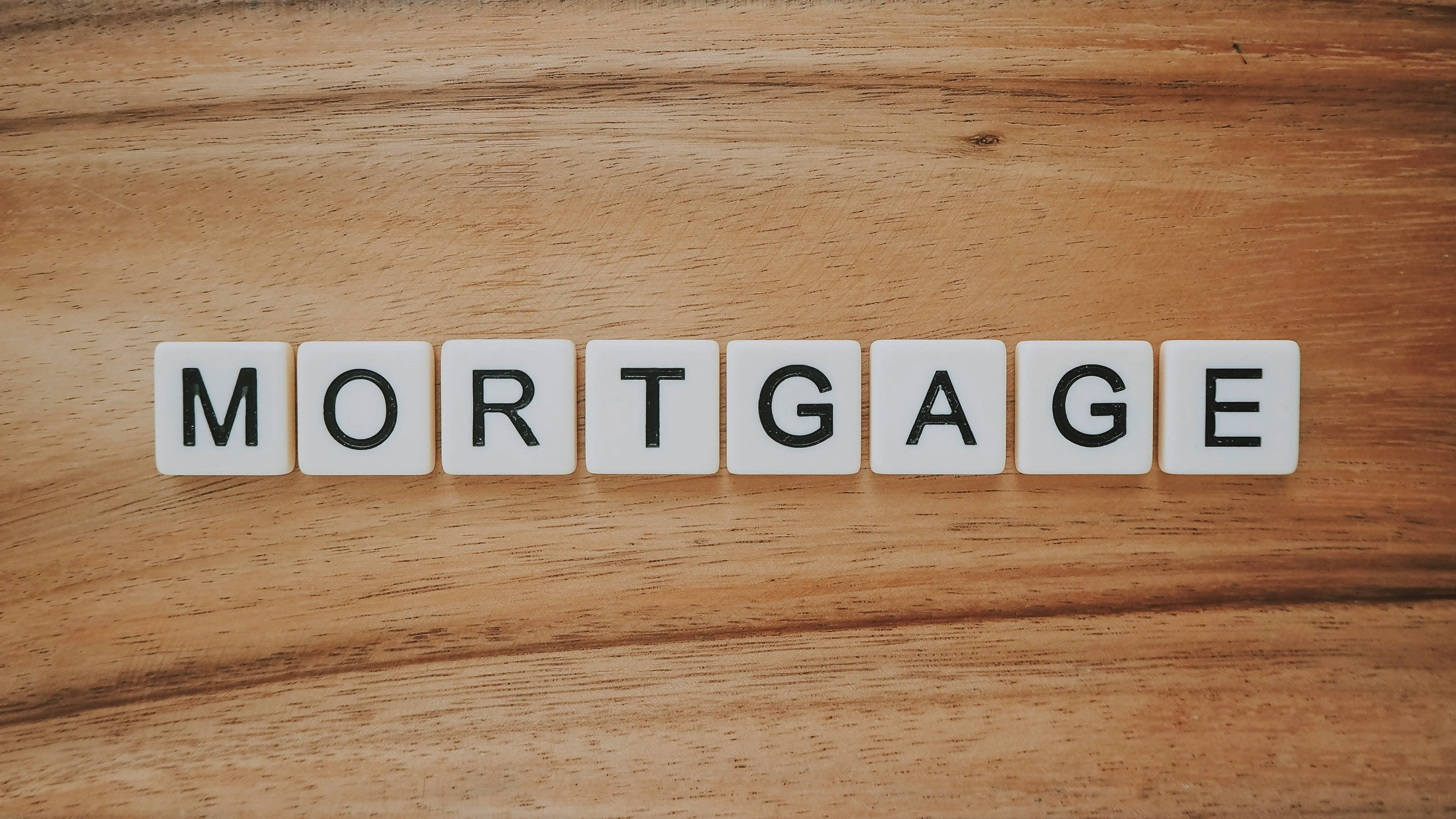 Mortgage spelled through scrabble tiles