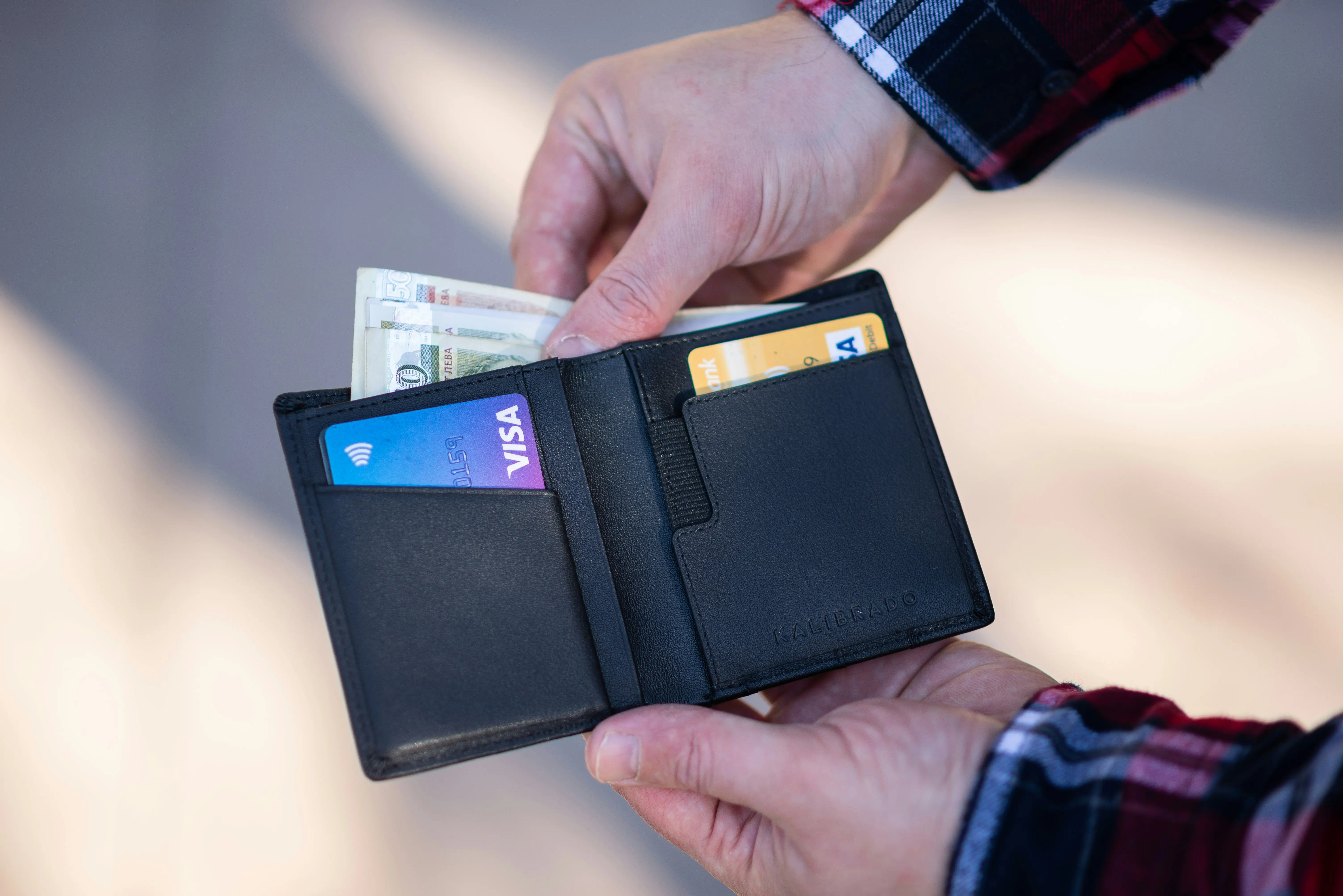 Person holding a wallet