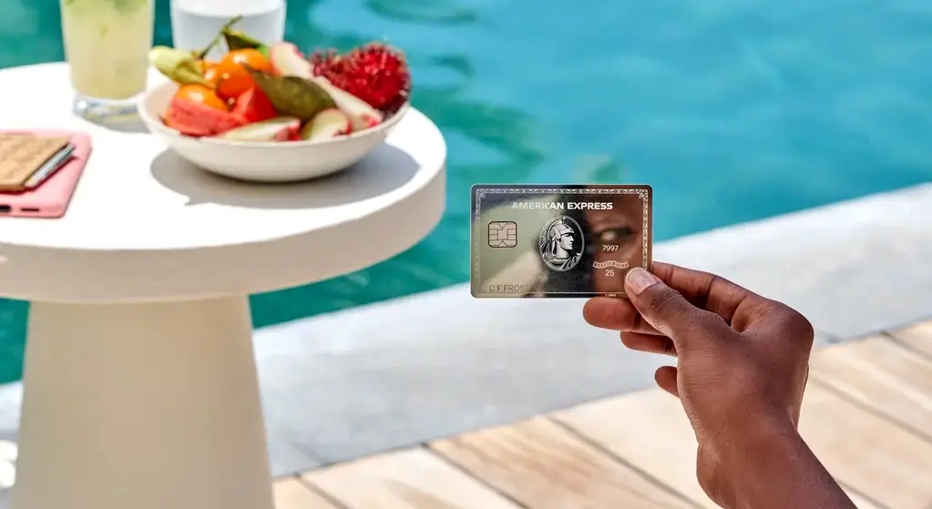 Three AMEX cards on a surface