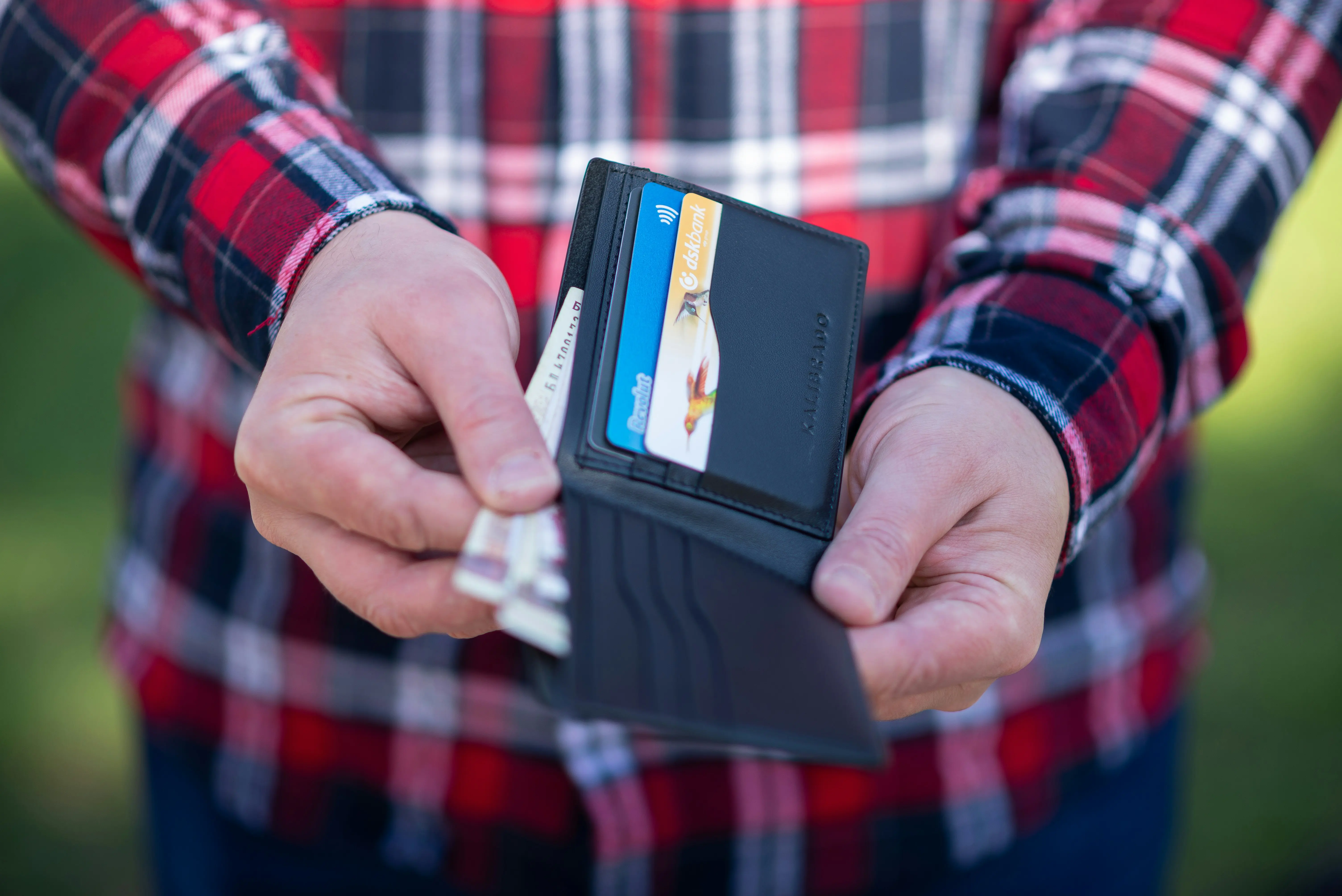Person holding a wallet