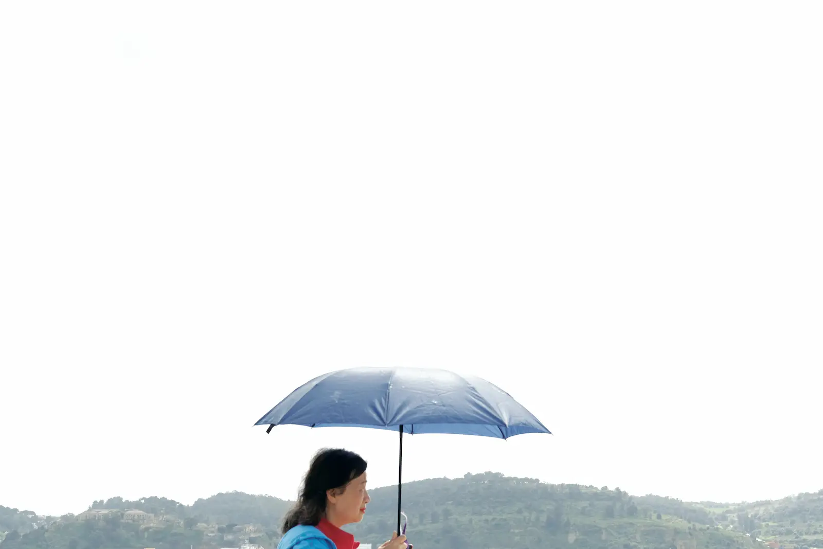 Person holding an umbrella
