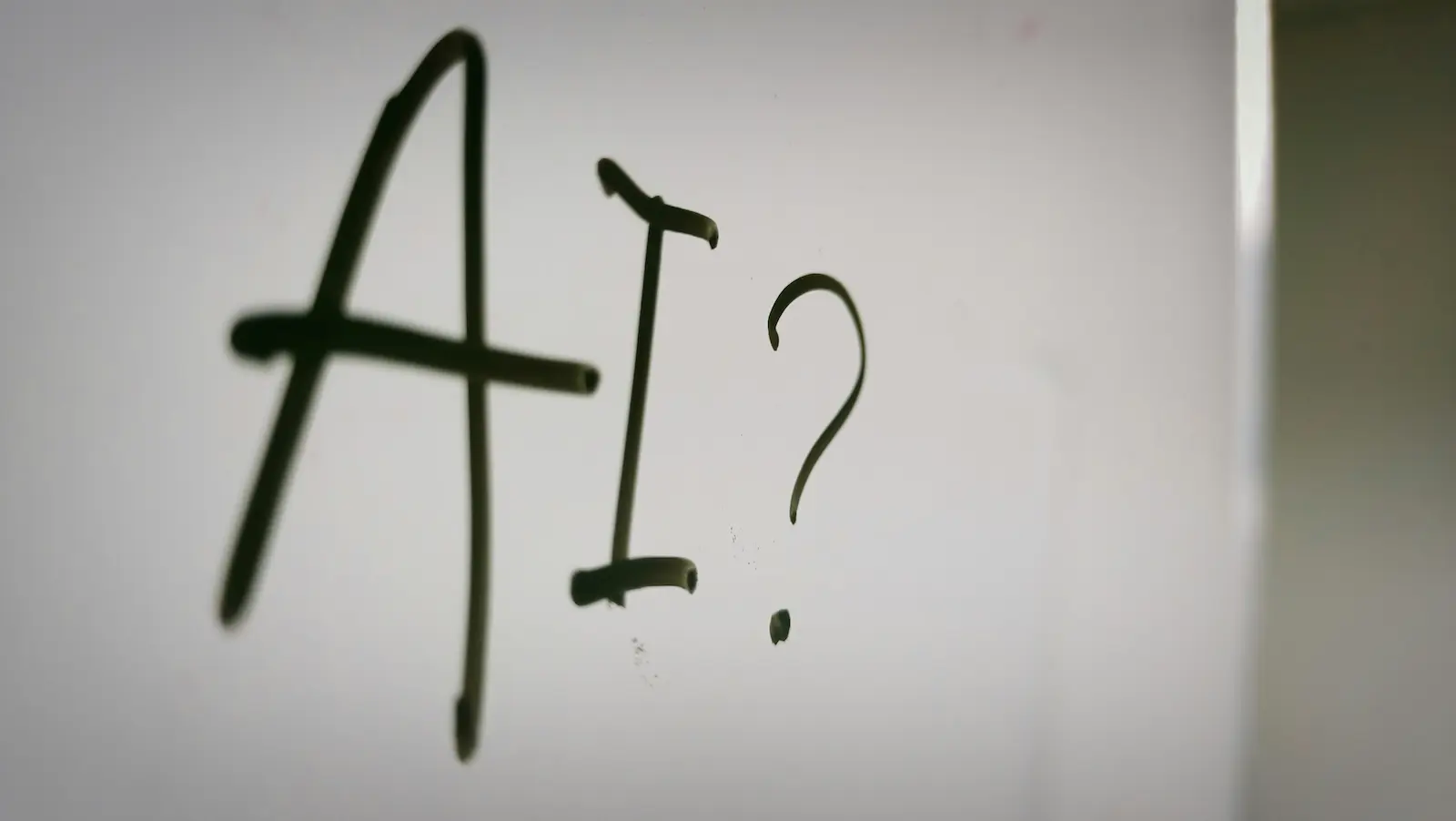 Word "AI" written on whiteboard
