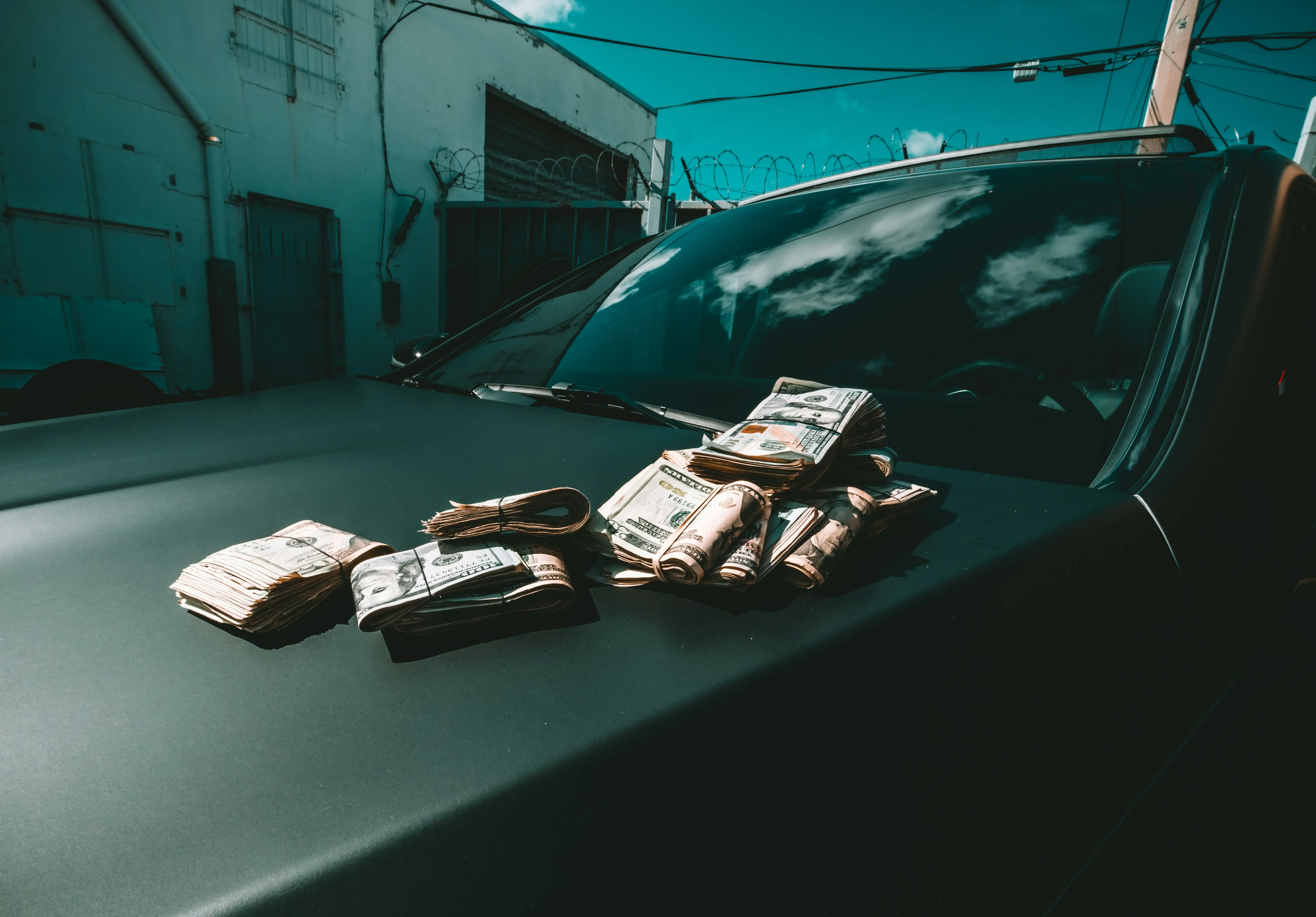 Bundles of money on a car
