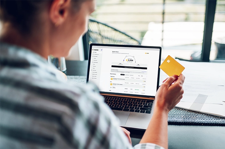 Woman on laptop with Kudos Boost