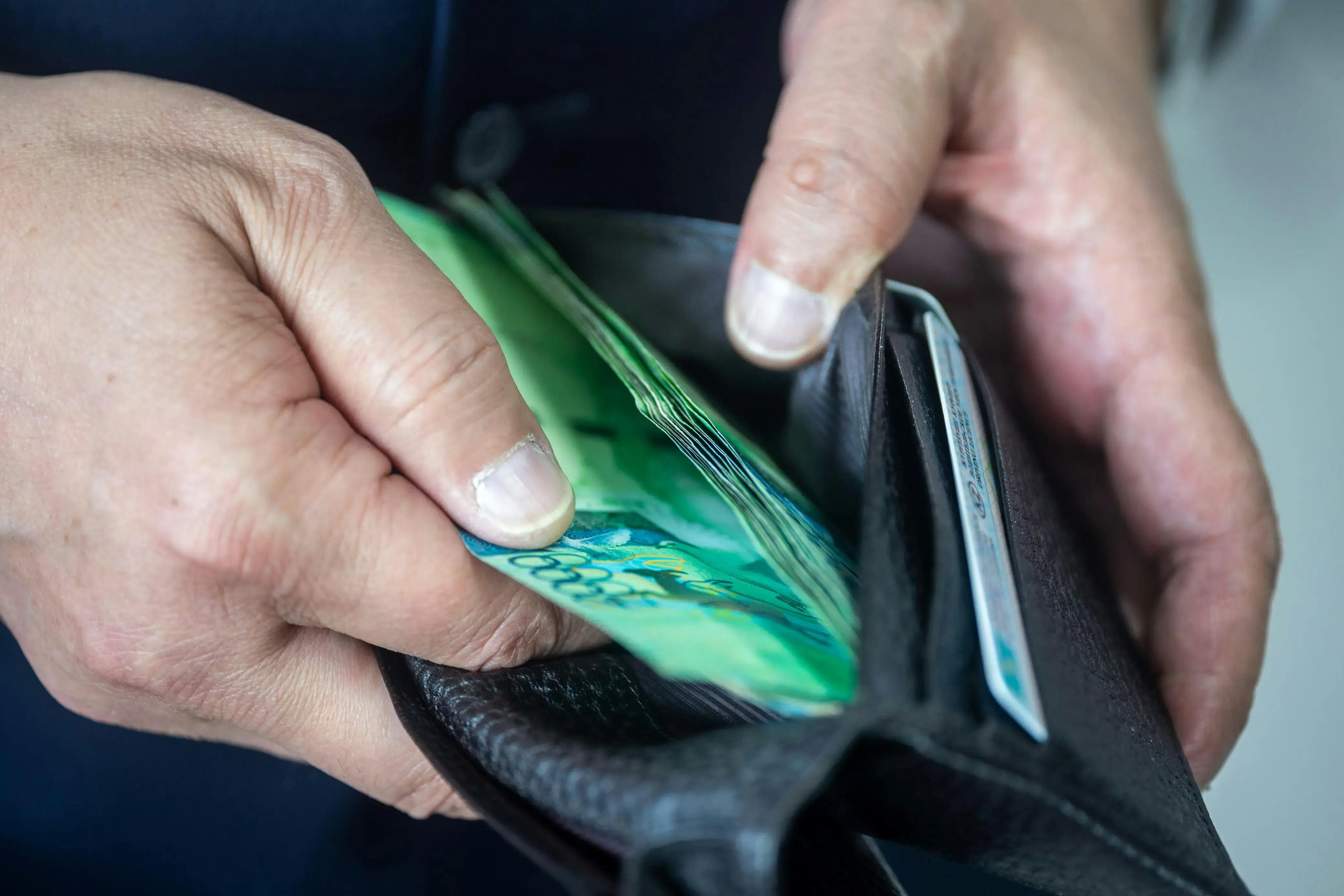 Person holding a wallet