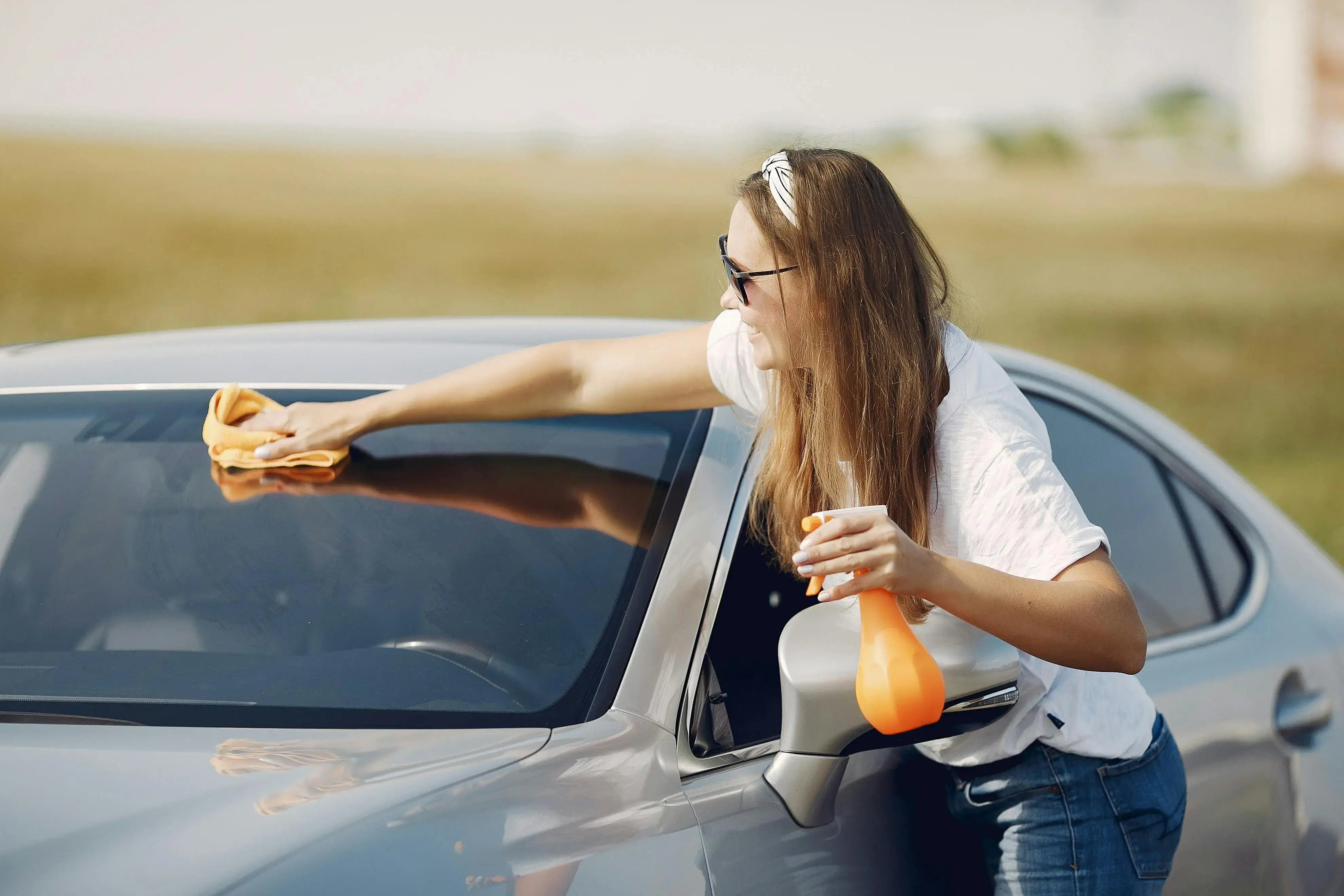 Person cleaning their car