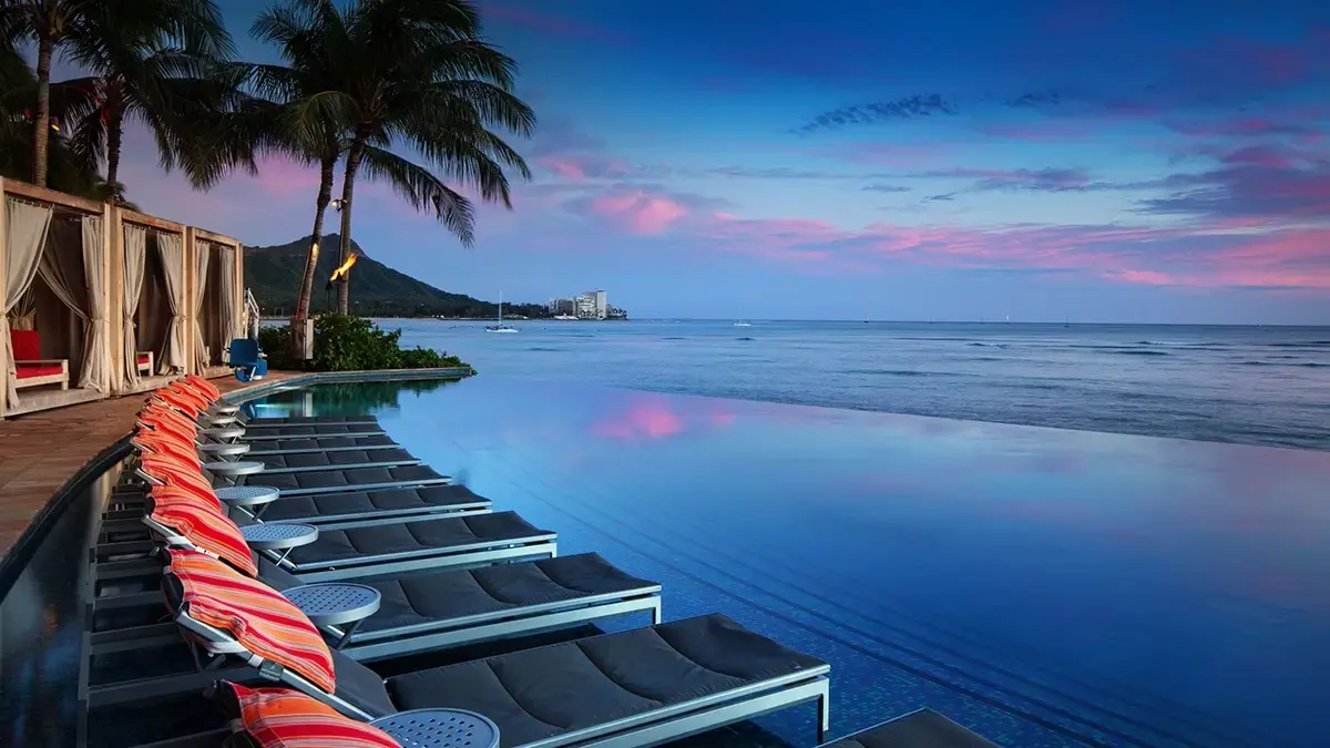 Luxury Marriott resort pool at sunset redeemable with Marriott Bonvoy Brilliant Bevy signup bonus points 2026