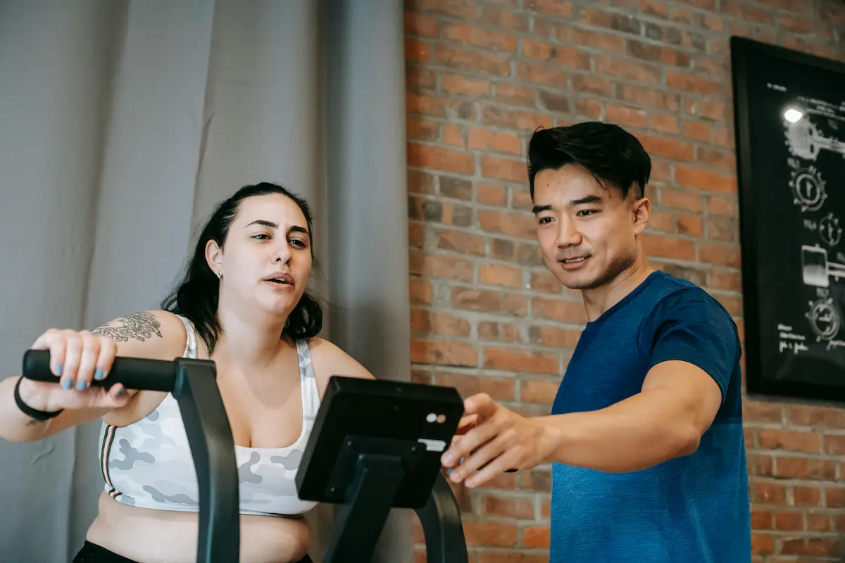 Person using fitness bike at home with Chase Sapphire Reserve free Peloton membership credit 2026