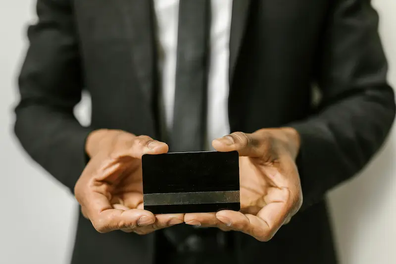 Premium metal credit card stainless steel construction weighing 13 to 18 grams more durable than plastic with do not shred warnings when expired or cancelled