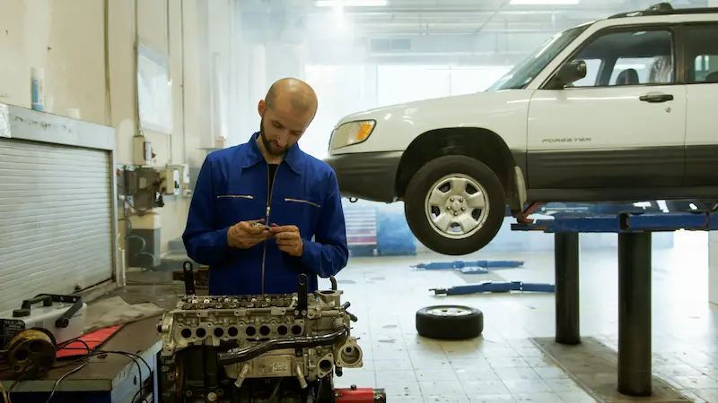 Auto repair shop store branded credit card financing option at checkout counter in 2026