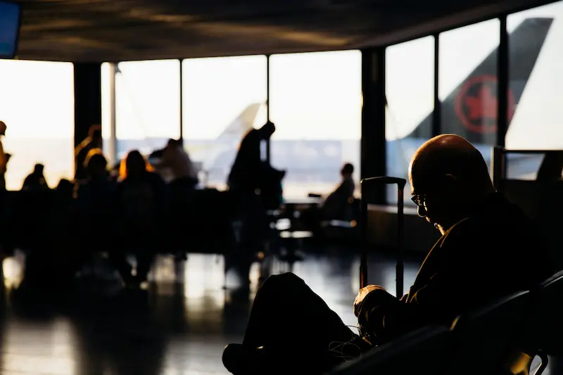 Traveler at airport departure gate — Chase Ultimate Rewards® points offer flexible redemptions across airlines and hotels in 2026