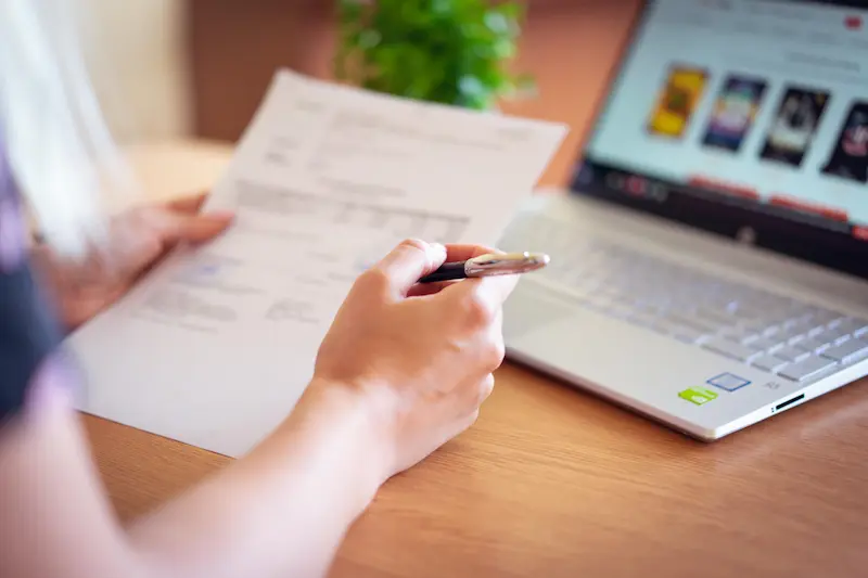 Person reviewing credit card options on a laptop — what to do if your retention offer request is denied in 2026