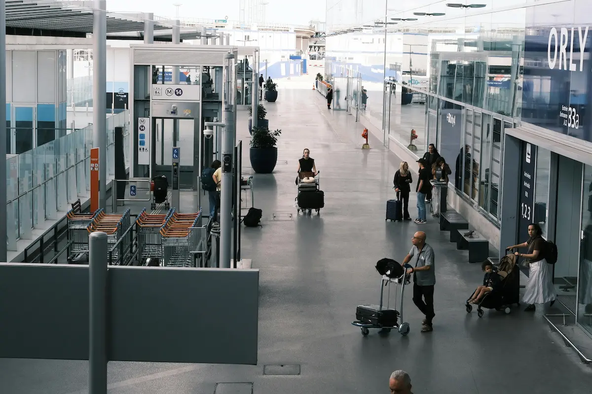 Traveler at airport — Capital One Venture X miles used to cover travel purchases directly in 2026