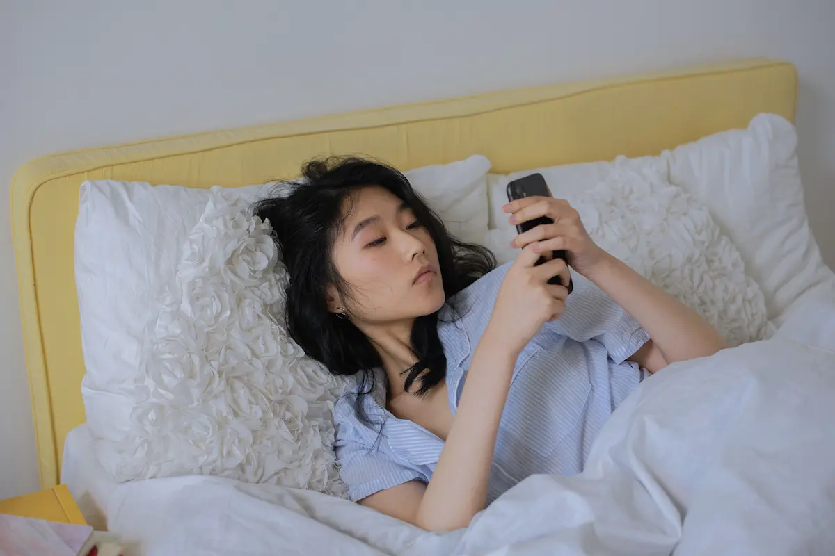 Person booking a hotel on their phone in 2026 — how to use Uber's Expedia partnership to save on stays