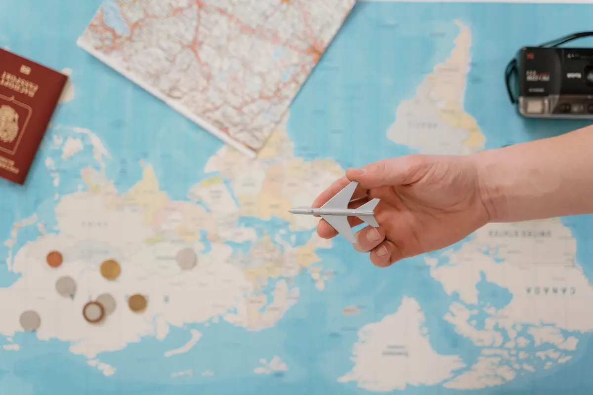 Fanned out travel rewards credit cards on a flat surface representing active points transfer bonuses in May 2026
