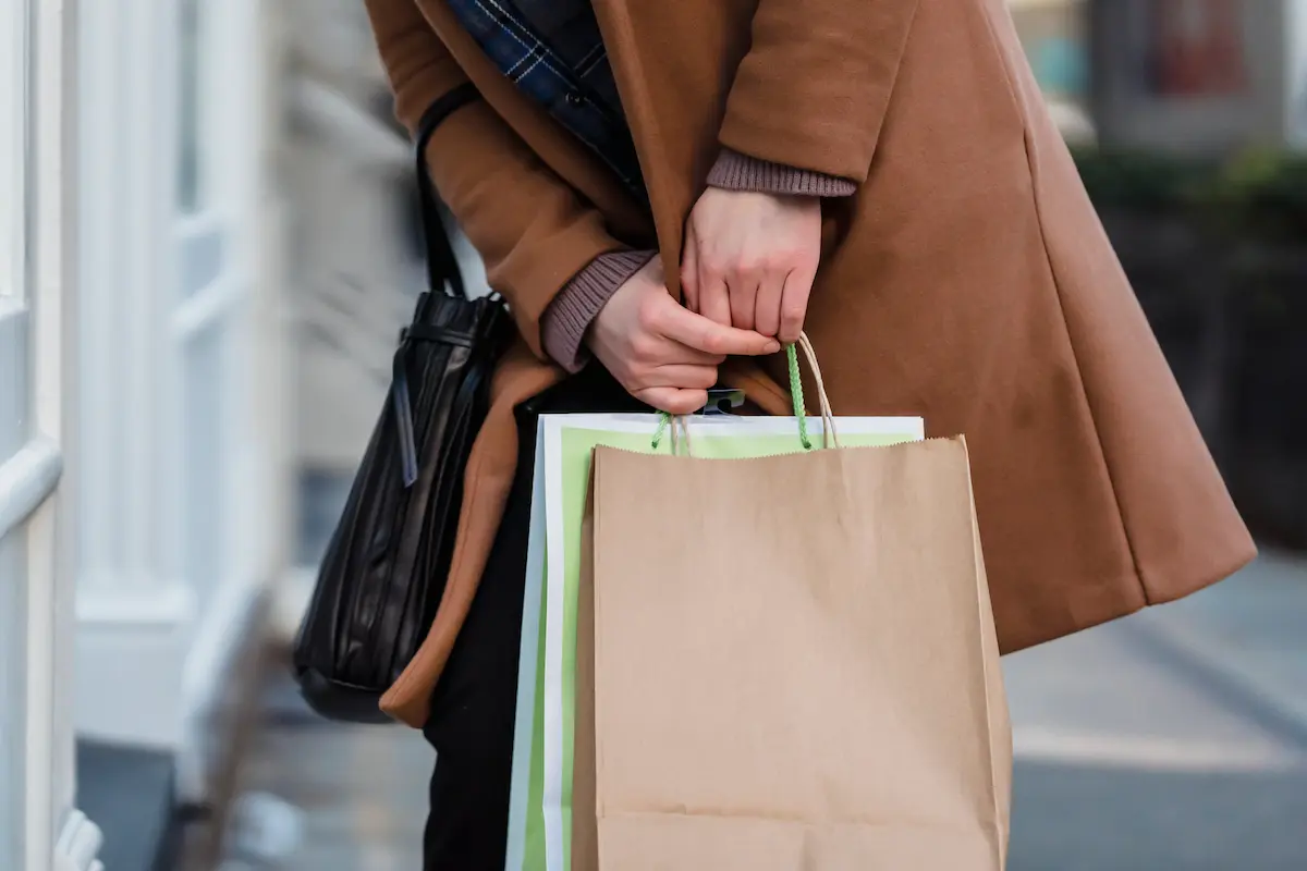Saks Fifth Avenue shopping bag with luxury purchases representing how to use the Amex Platinum $50 Saks statement credit before it expires on June 30, 2026.