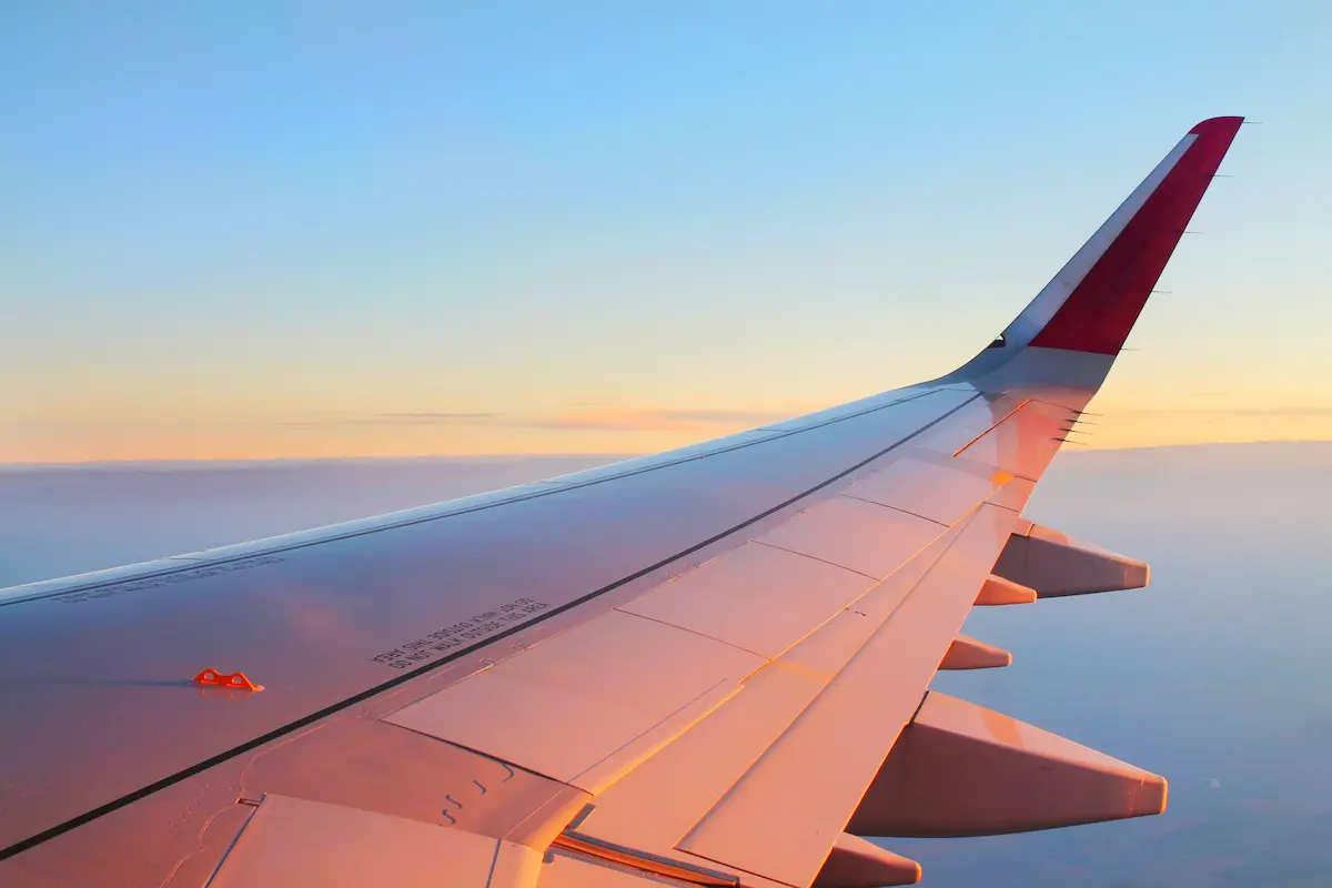 View from an airplane window at altitude, representing international award travel from a points transfer bonus