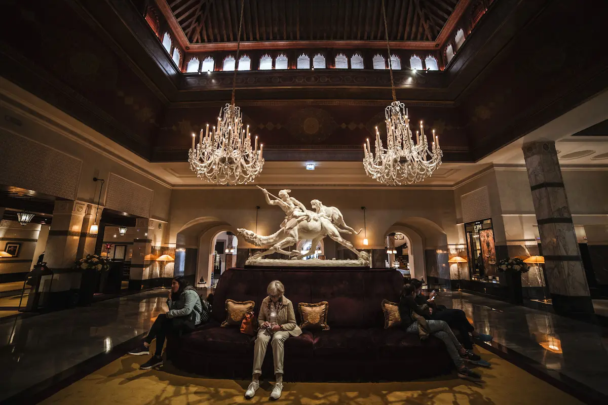 Ornate luxury hotel lobby with crystal chandeliers, representing Amex Membership Rewards' new transfer partnership with Leading Hotels of the World