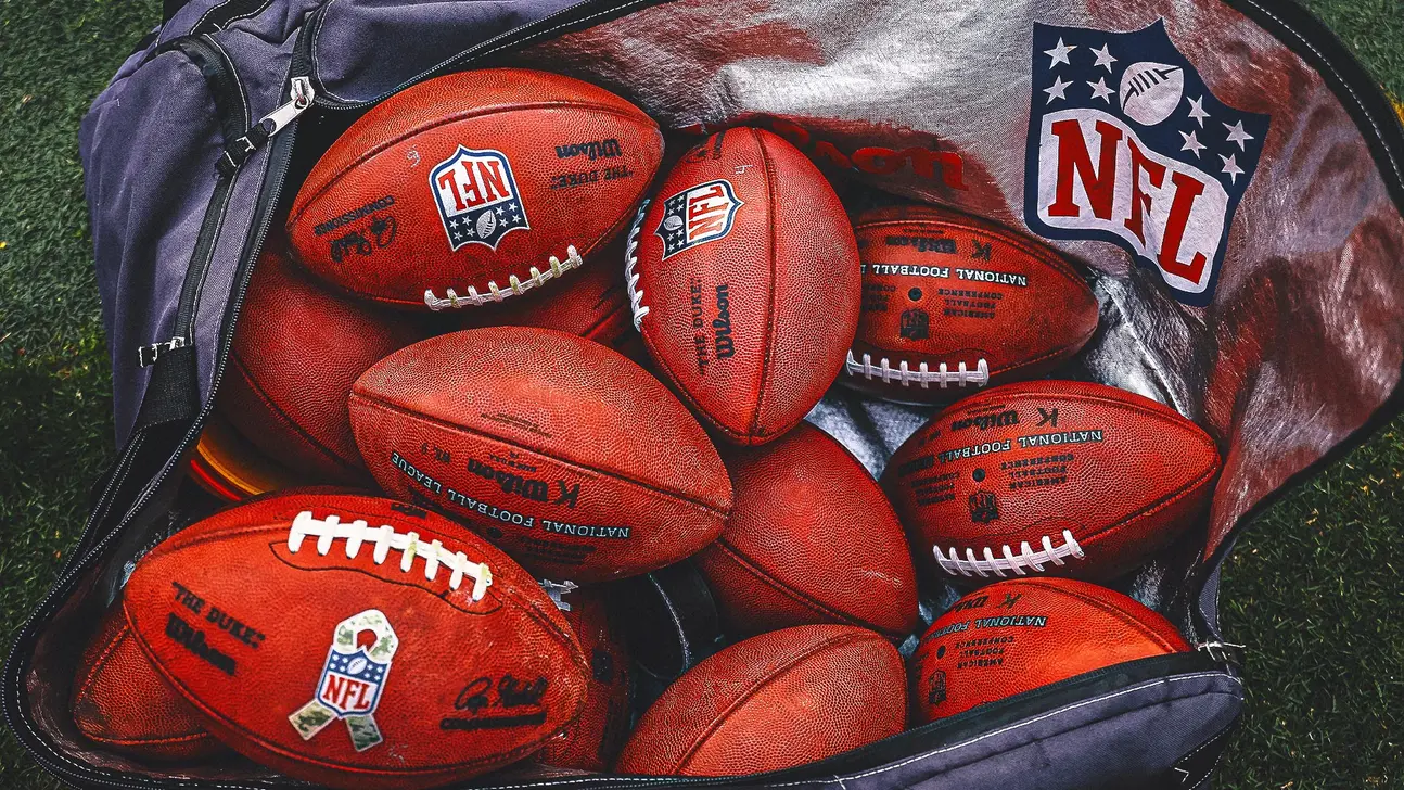 NFL footballs in a bag