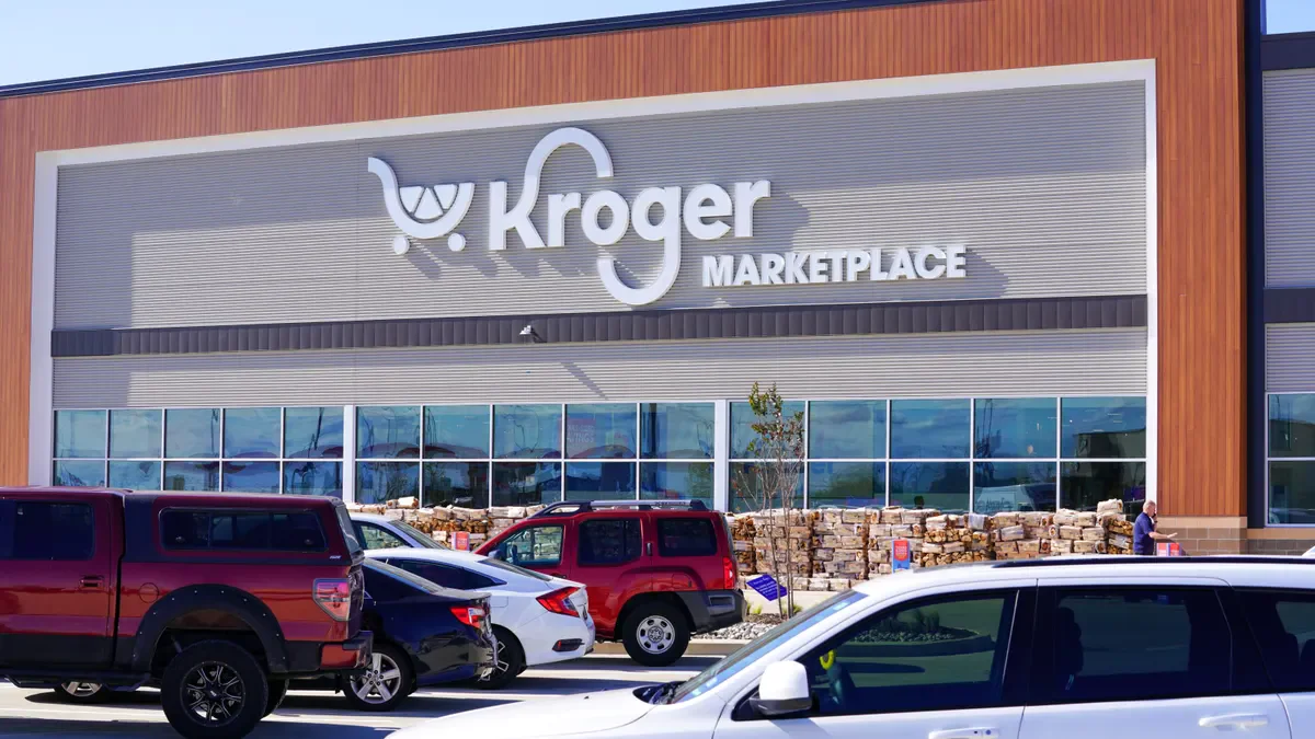 Exterior of a Kroger Marketplace store with cars parked in front
