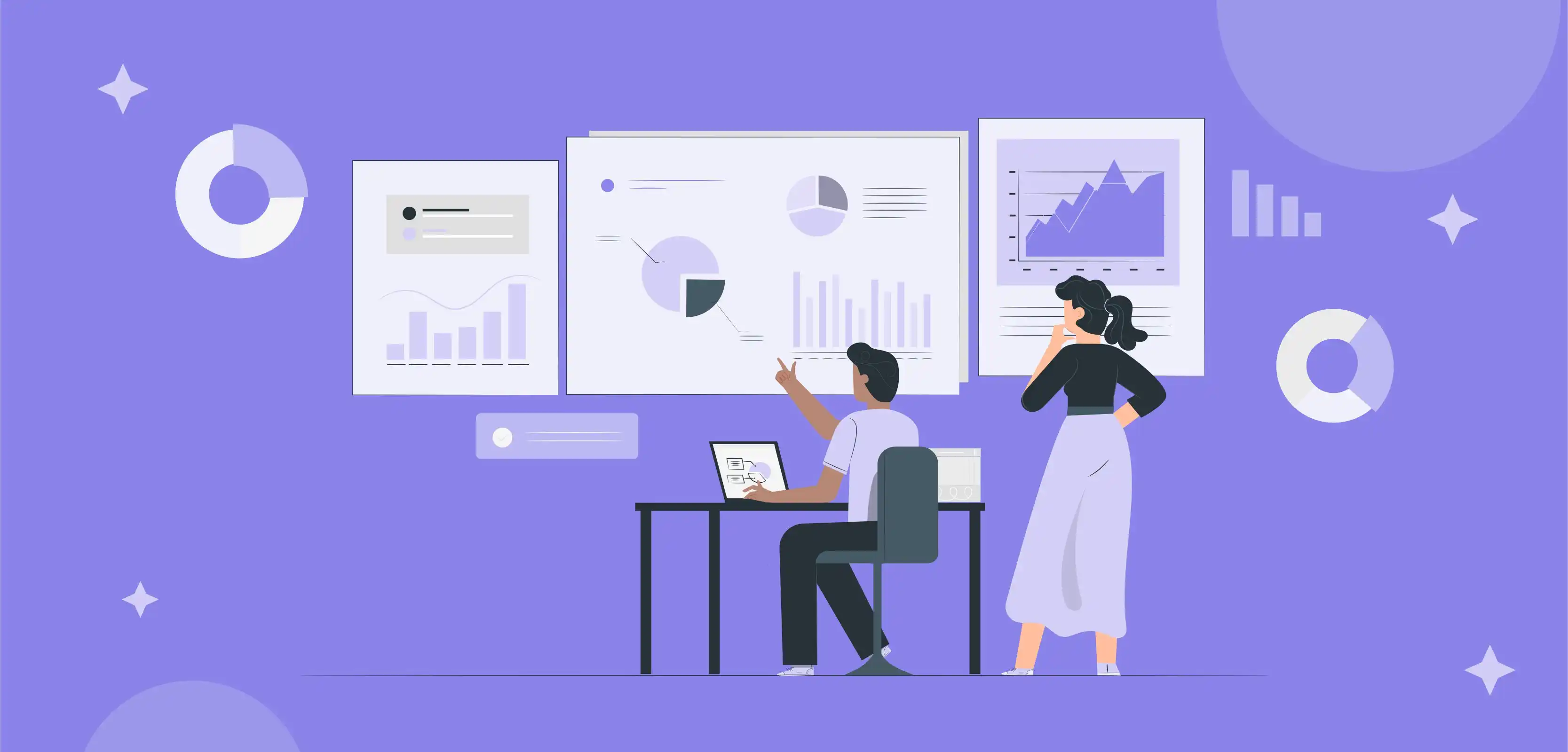 A Man Wearing Purple Tshrt & Black Pants Sitting on Chair With Laptop on Table showing Some Chart Displaying On Wall To Woman who is Wearing Black Tshrt and Purpule Pant