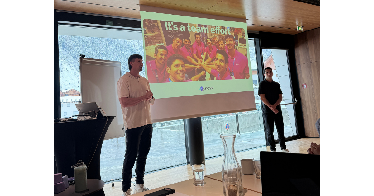 Members of Anchor’s Sales team presenting slides to a group of colleagues.