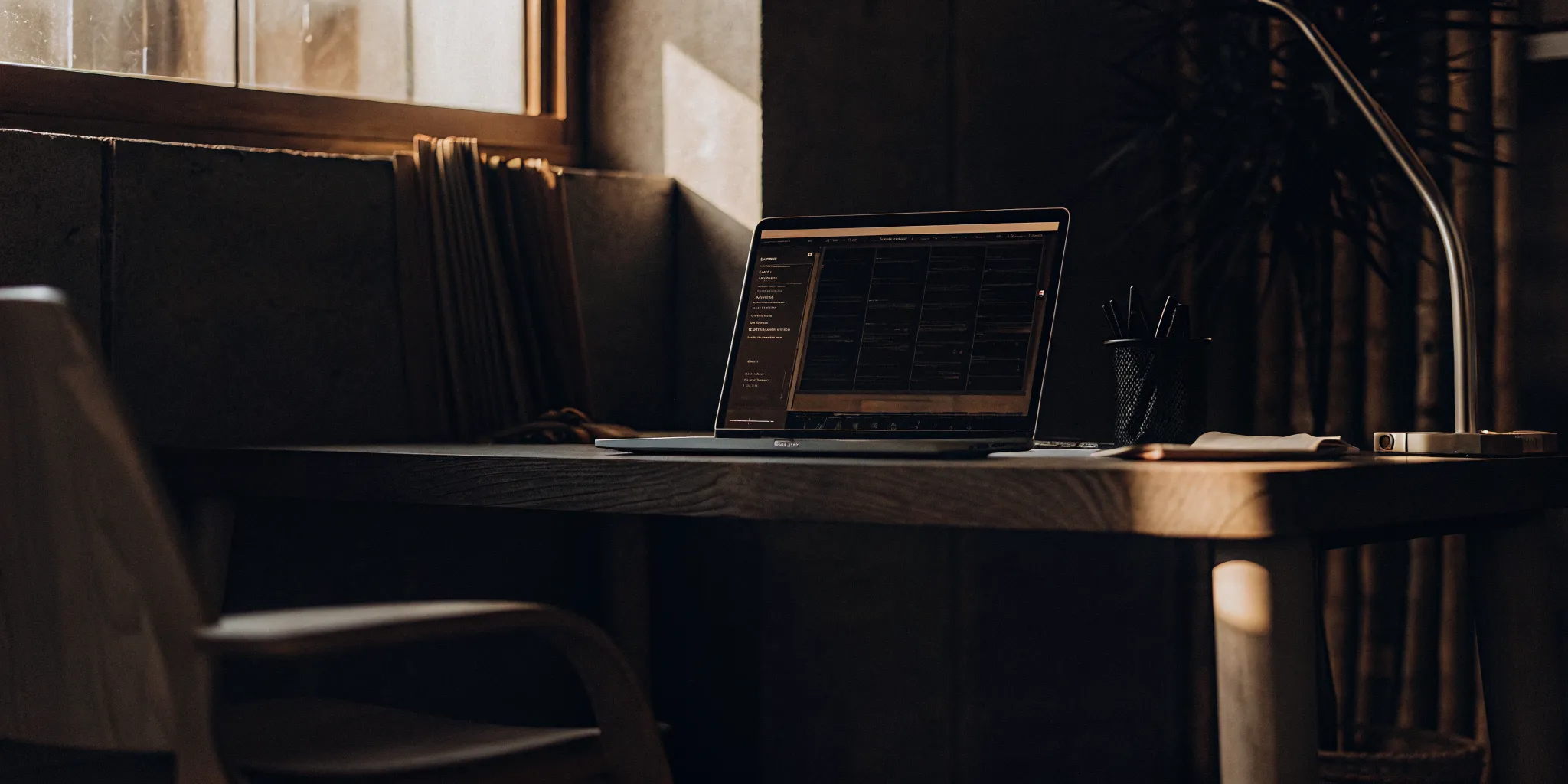 A clean modern desk with a laptop showing an automated billing dashboard for an accounting firm workspace