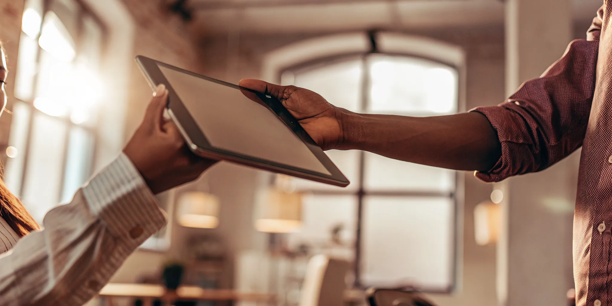 accountant and client reviewing a digital statement of work for accounting firms on a tablet and signing it in minutes