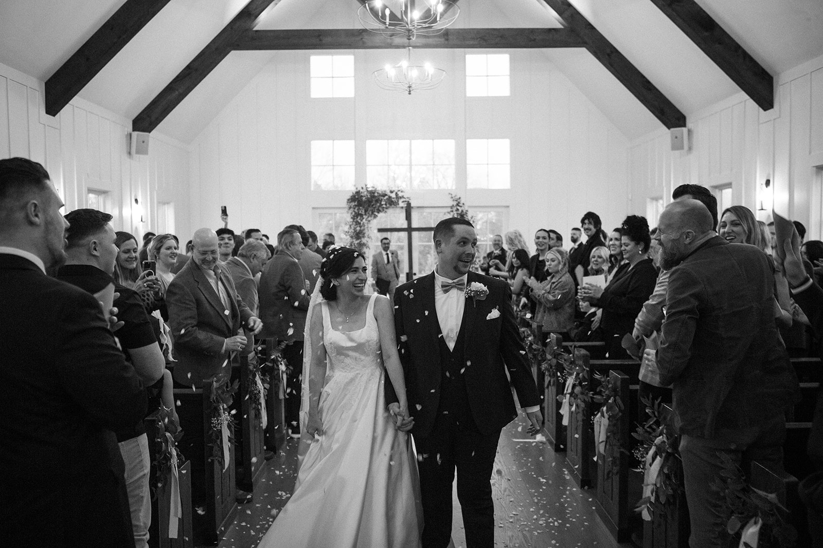 Matt and Paula walking down the aisle at their wedding