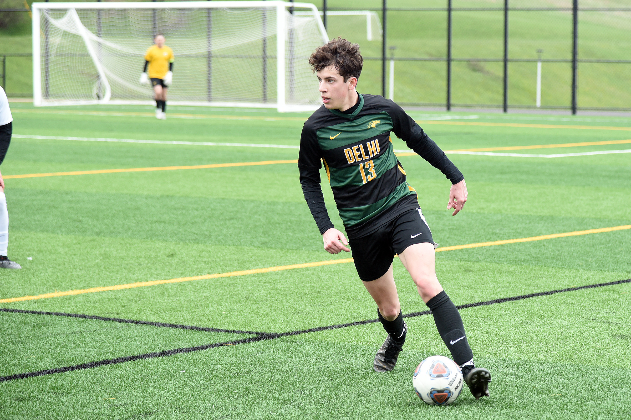 action shot of girl spiking volleyball
