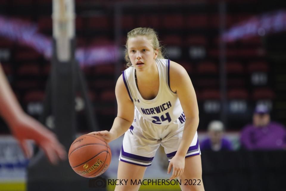 action shot of girl spiking volleyball
