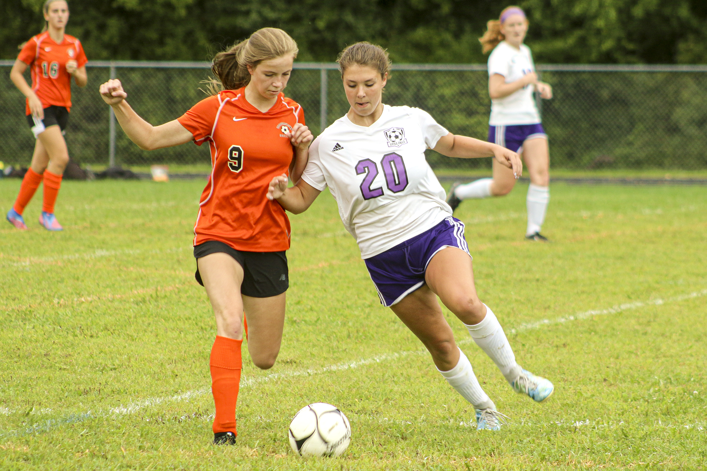 action shot of girl spiking volleyball